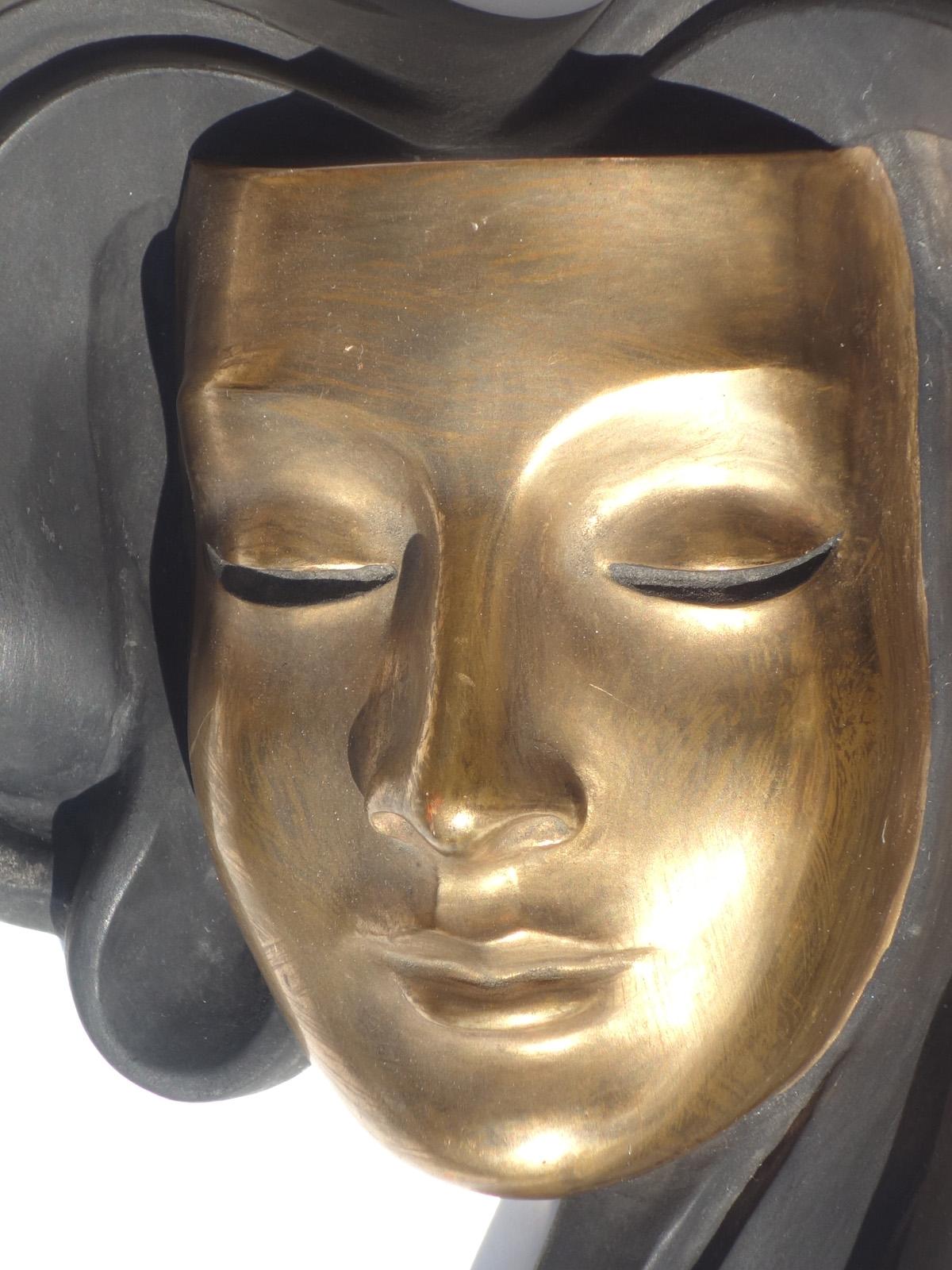 Black and gold ceramic Achatit figure mask.