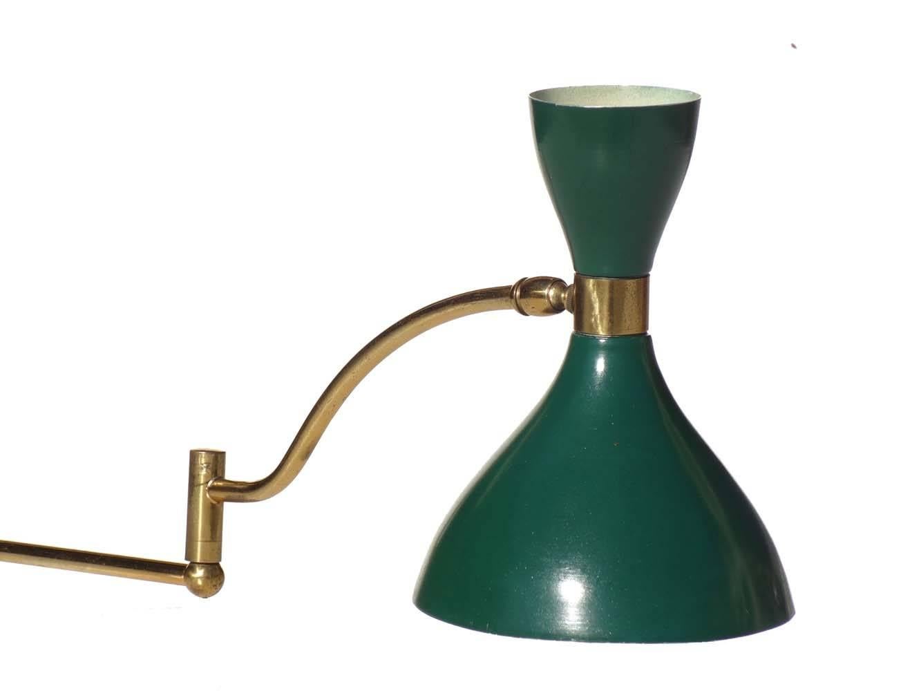 Adjustable wall lamp
by Stilnovo
Italy, 1950s

Green and ivory aluminum shade
Polish brass frame

Excellent condition.
Original 1950s.
 
