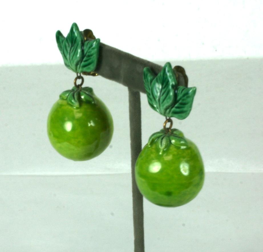 Fun California Pottery Lime motif earrings from the 1950's. Hand made with vibrant limes hanging from deep green leaf pottery ear clips. 1950's USA. 
Clip back fittings.  2.5