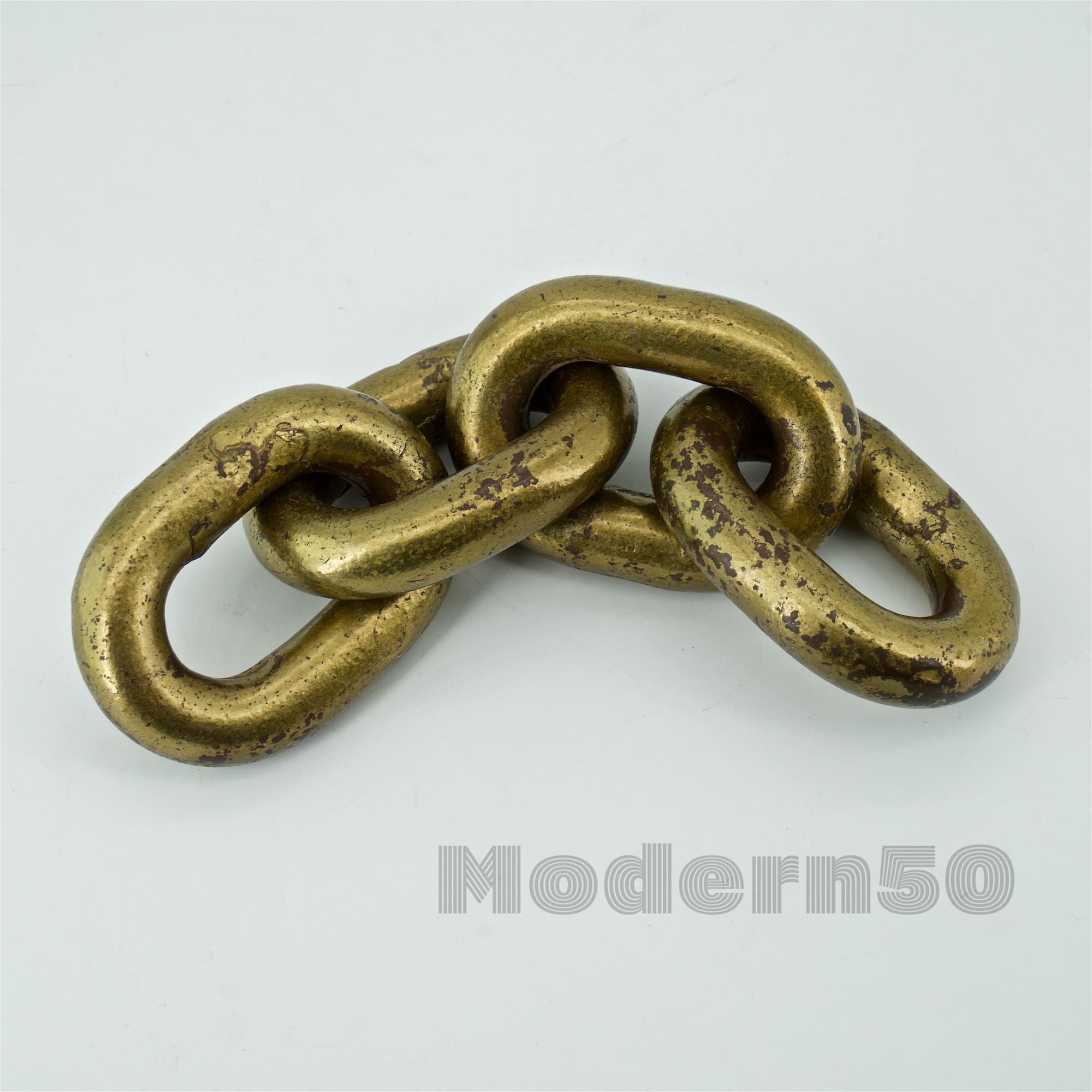 Sought after early chain paperweight, golden brass plated, and lacquered steel by Werkstätte Carl Auböck, Austria, circa 1950s. Heavily worn, showing a wonderful patina and age. Weight: 2 1/4 lbs. Length 8 in.
  