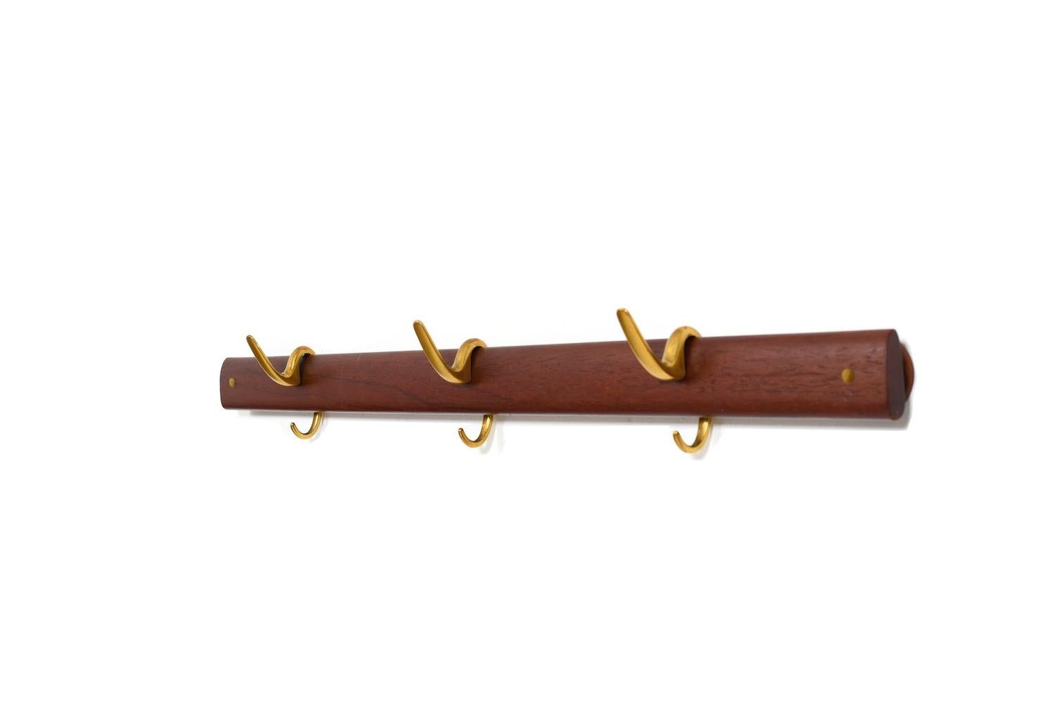 Mid century wardrobe by Carl Auböck. Made in solid teak and brass hooks. Denmark 1950s.