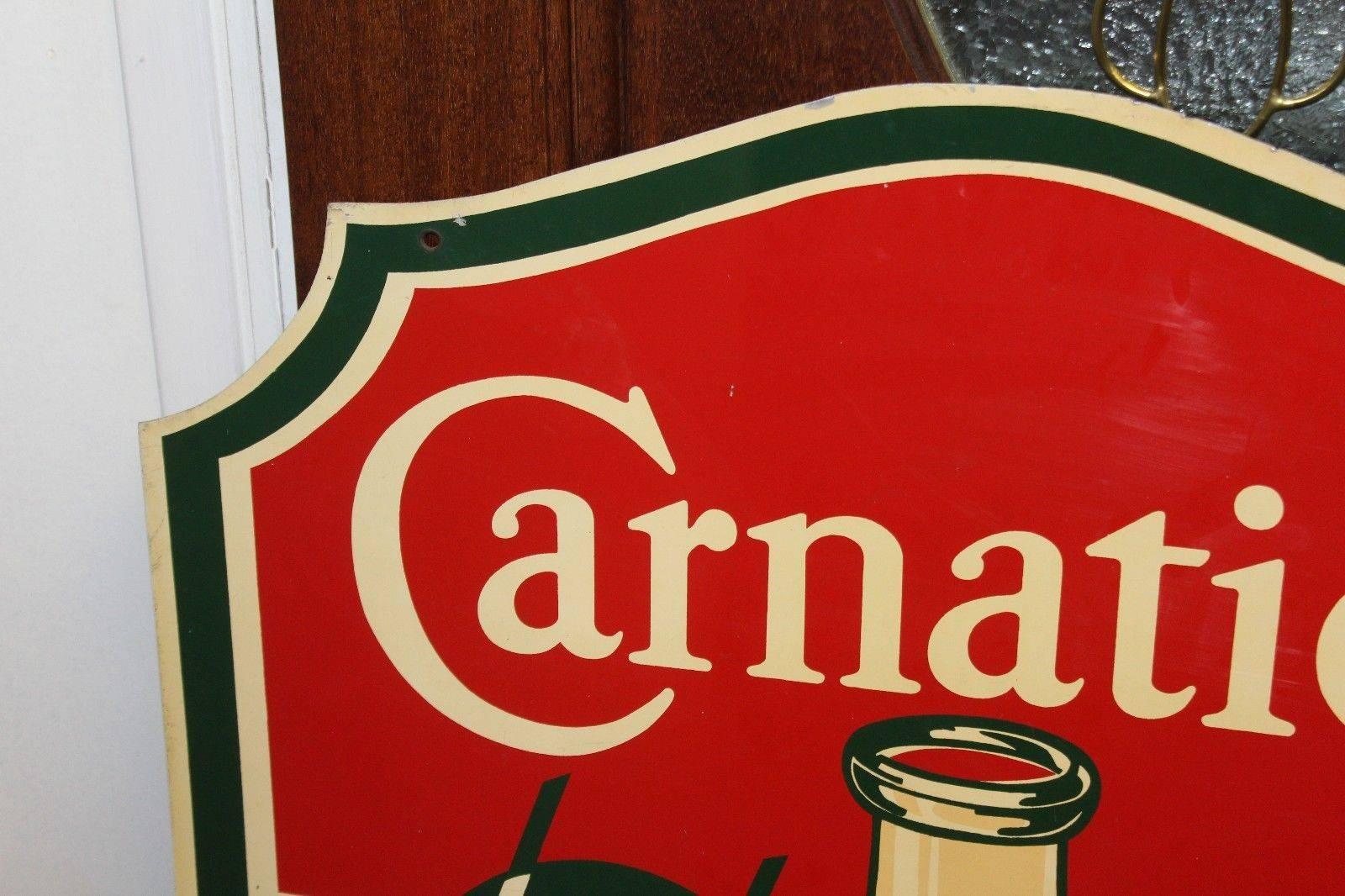Carnation milk advertising sign was once original owned by Walt Disney Imagineer John Patrick Burke. Great original condition. Amazing die-cut shaped sign that's double sided.