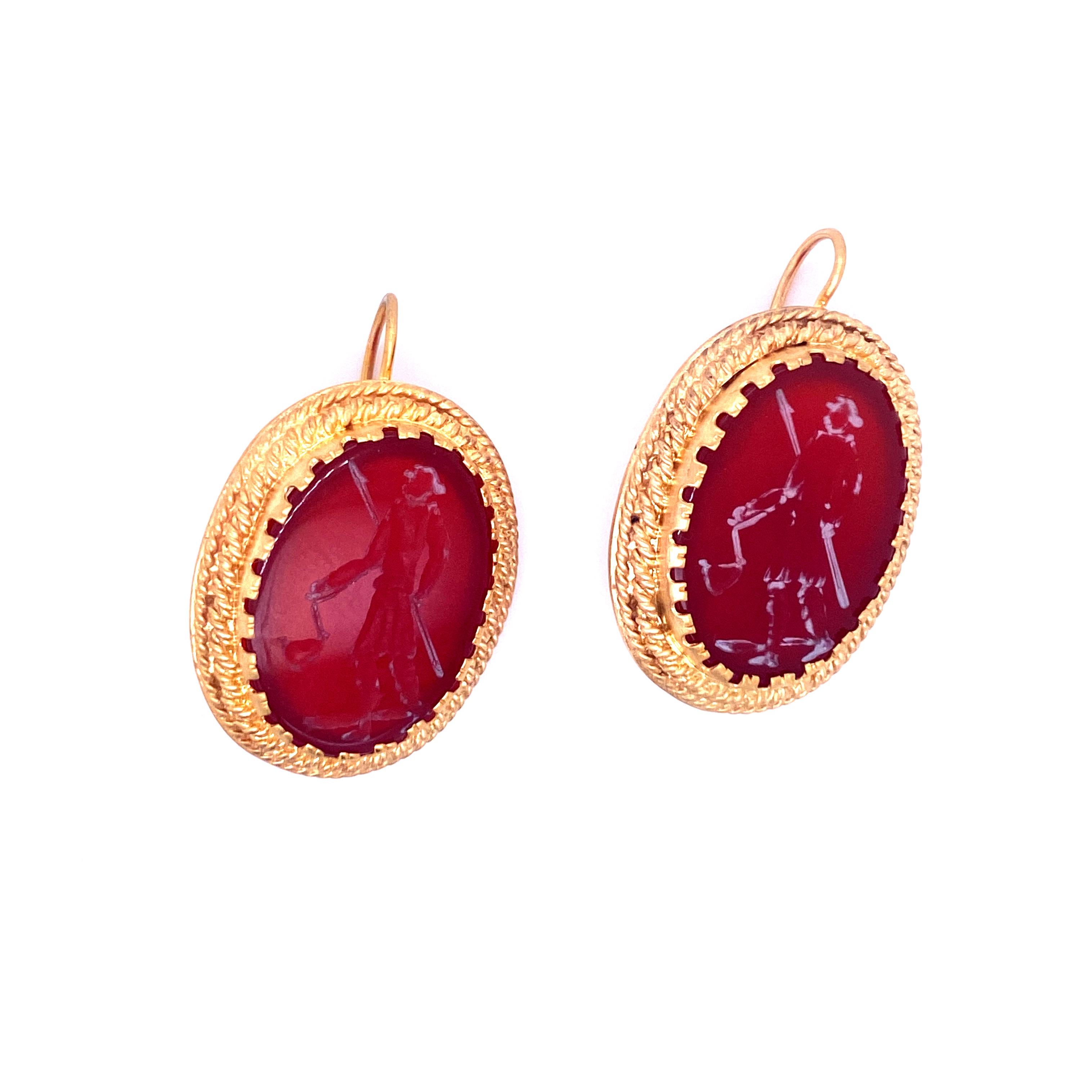 An unusual pair of vintage earrings, presenting two fine 19th century intaglios in Cornelian, framed in 18k yellow engraved Gold 
Origin Italy 1950

CONDITION: Pre-owned - Excellent 
METAL: 9k Gold
STONE: Diamond 0.50 total carats 
WEIGHT: 12 grams
