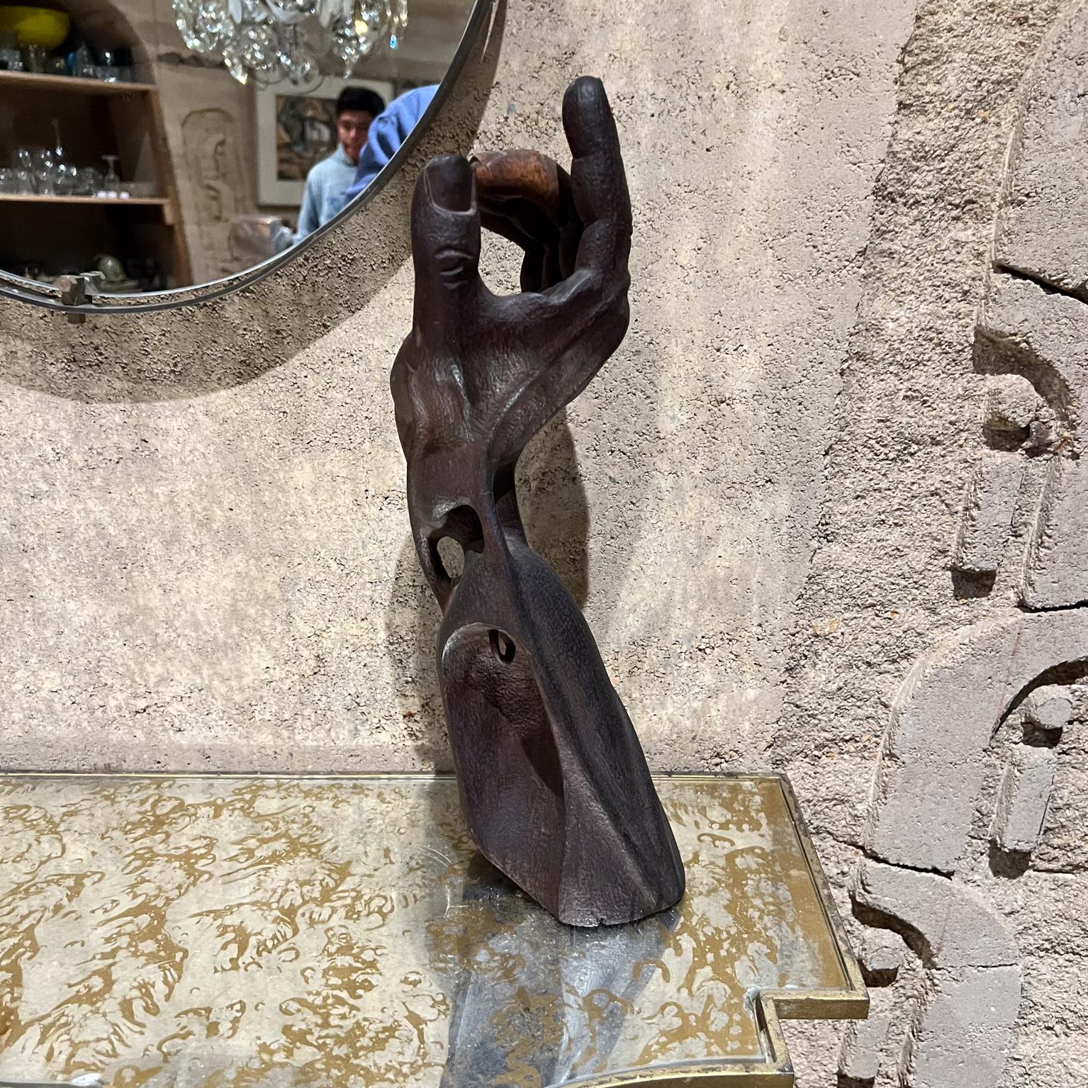 Modern Brutalism Wood Hand Sculpture carved dark wood rich patina. 
In the manner of Mathias Goeritz Mexico
Unsigned. 
16 H x 5 W x 7 D.
Original vintage unrestored condition. Patina present. No base.
Two fingers at the top have a lighter
