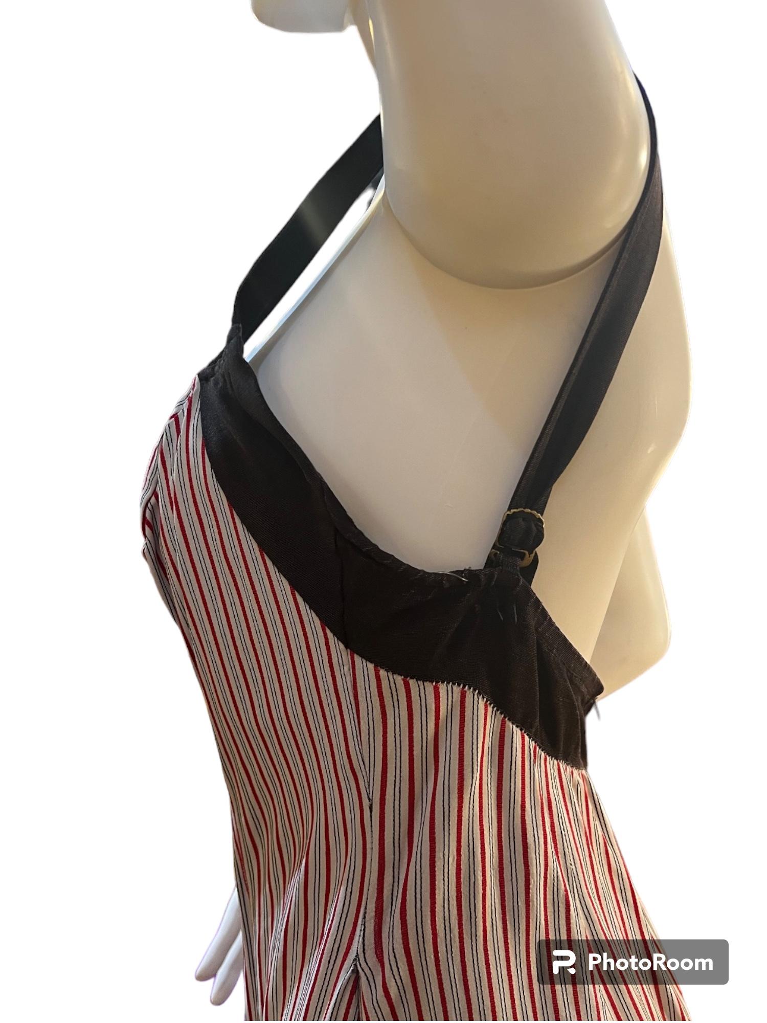 RARE 1950's Catalina of California brown, red, and white striped one piece sheath style swimsuit.
Super cute and adjustable straps on the back with a zipper.
Vintage size 14/36. Would best fit a Small or Medium.
Some small holes in the lining of the