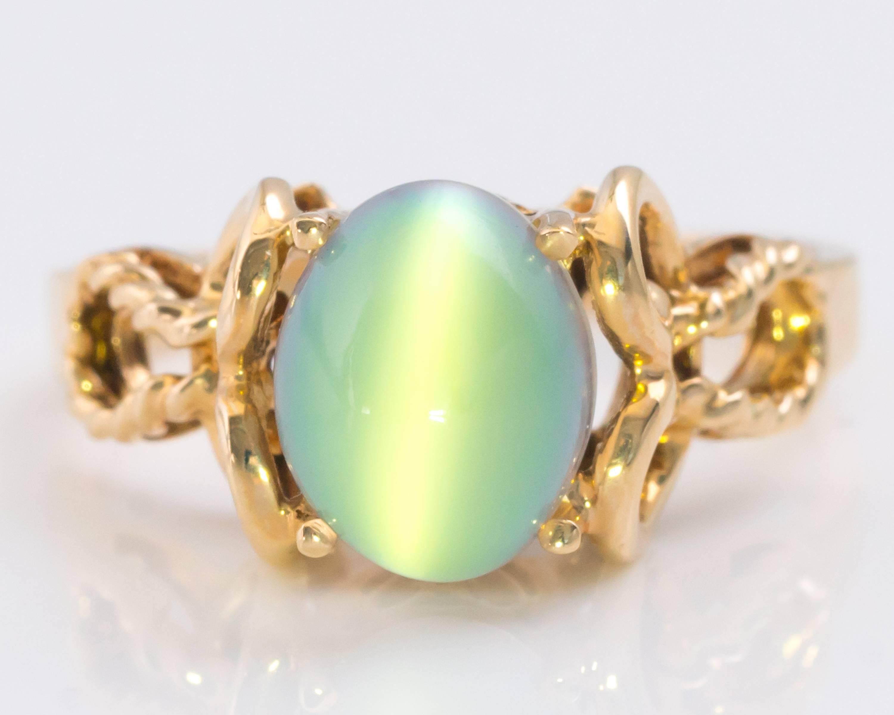 1950s Cat's Eye Moonstone Ring - 10 Karat Yellow Gold

Features an Oval Moonstone Cabochon with pronounced Cat's Eye prong set in 10 Karat Yellow Gold. 

The Moonstone exhibits shades of purple, green and blue. The colors change with light and