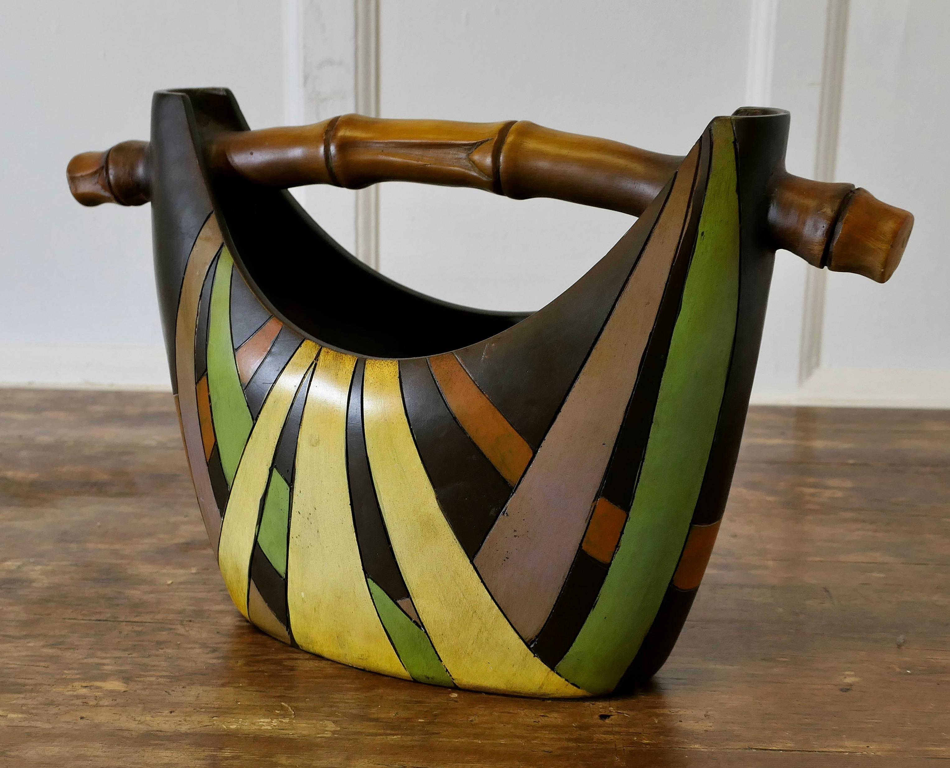 1950s Ceramic Flower Vase in the form of a Basket

Charming and Kitsch, this gondola Basket simulates a banana leaf weave basket with a  chunky bamboo handle, it is light in weight and has an internal reservoir with openings to support your