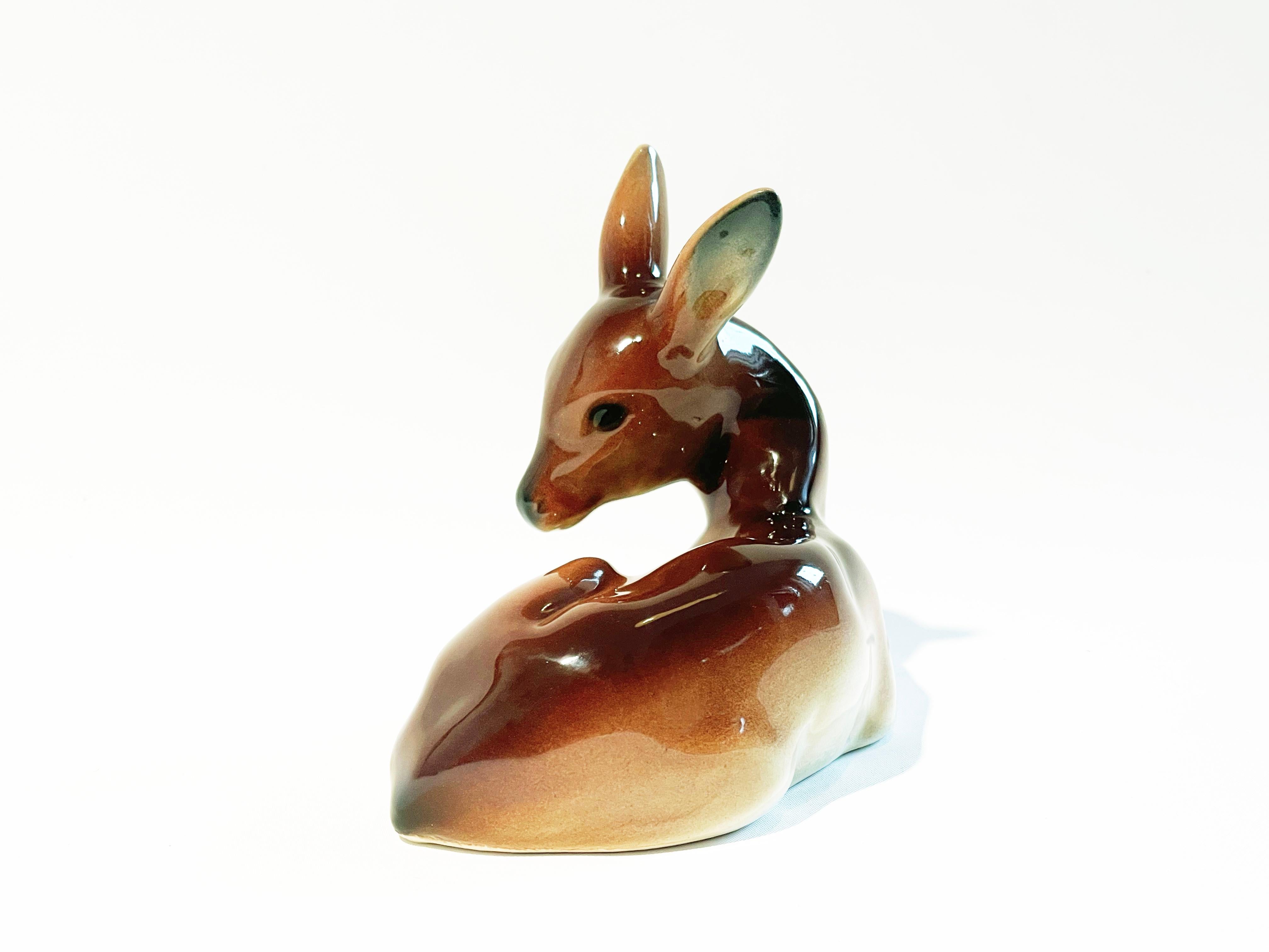 A beautifully designed fawn by W. Goebel, one of Western Germany's most famous makers of mid-century figurative art.
Designed and made around 1950-1960.
Started as Cortendorf, later it was taken over by W. Goebel.

The figurine comes in a shiny,