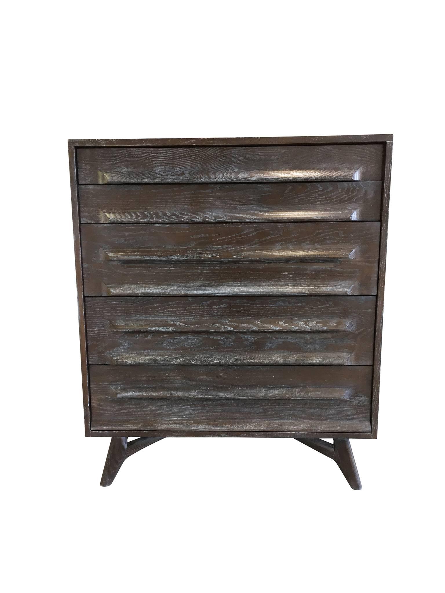 This truly elegant, iconic case piece is a chest of drawers designed by Jack Van der Molen for Vanleigh Furniture in the 1950s. It is comprised of beautifully grained oakwood which has been newly cerused. The finish adds a warm tone of gray to the
