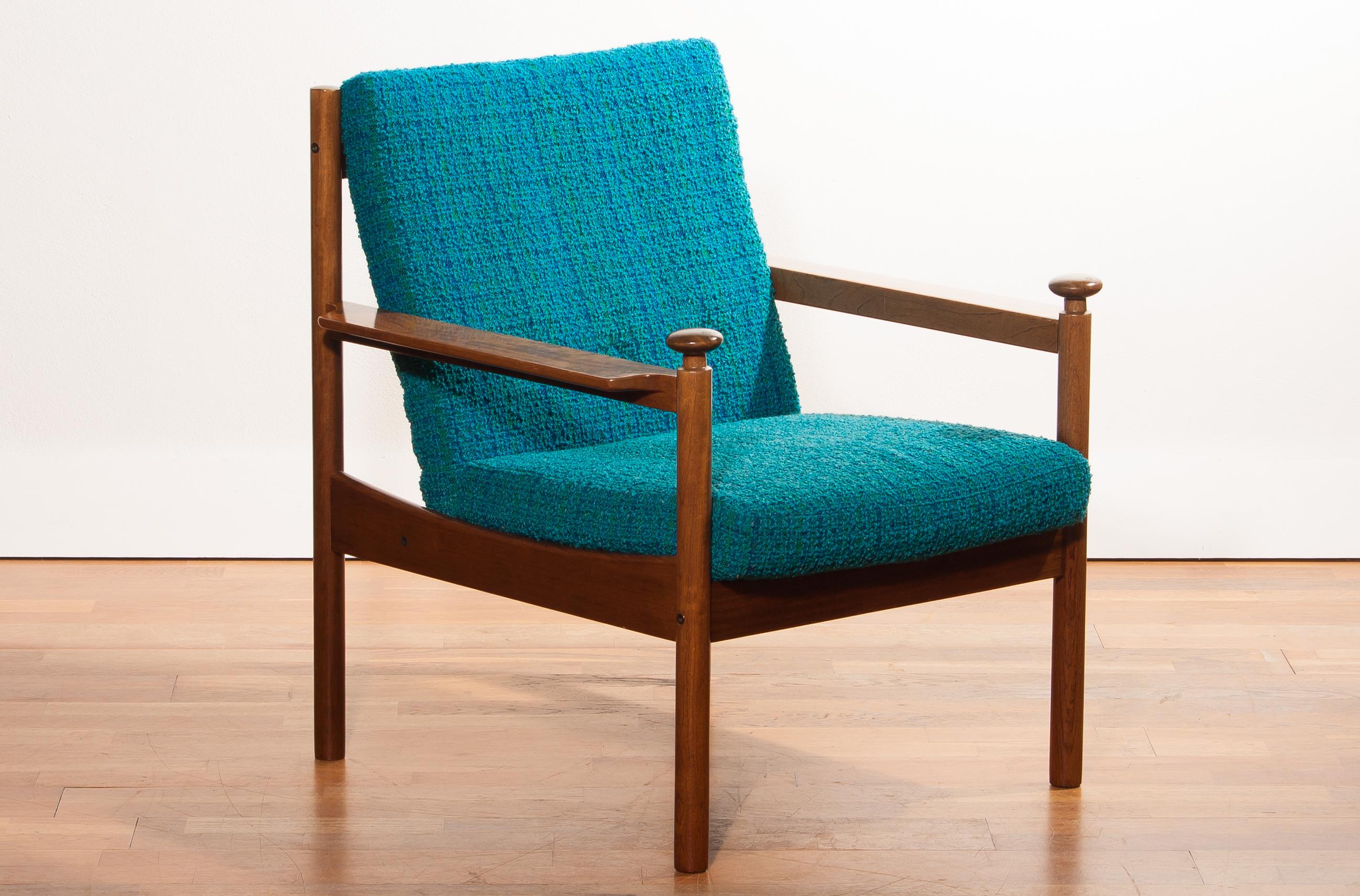 Beautiful chair designed by Torbjørn Afdal for Sandvik & Co. Mobler, Norway.
The wooden frame with the blue fabric cushions makes it a very nice combination.
It is in good condition wear consistent with age and use.
Period 1950s
Dimensions: H 83