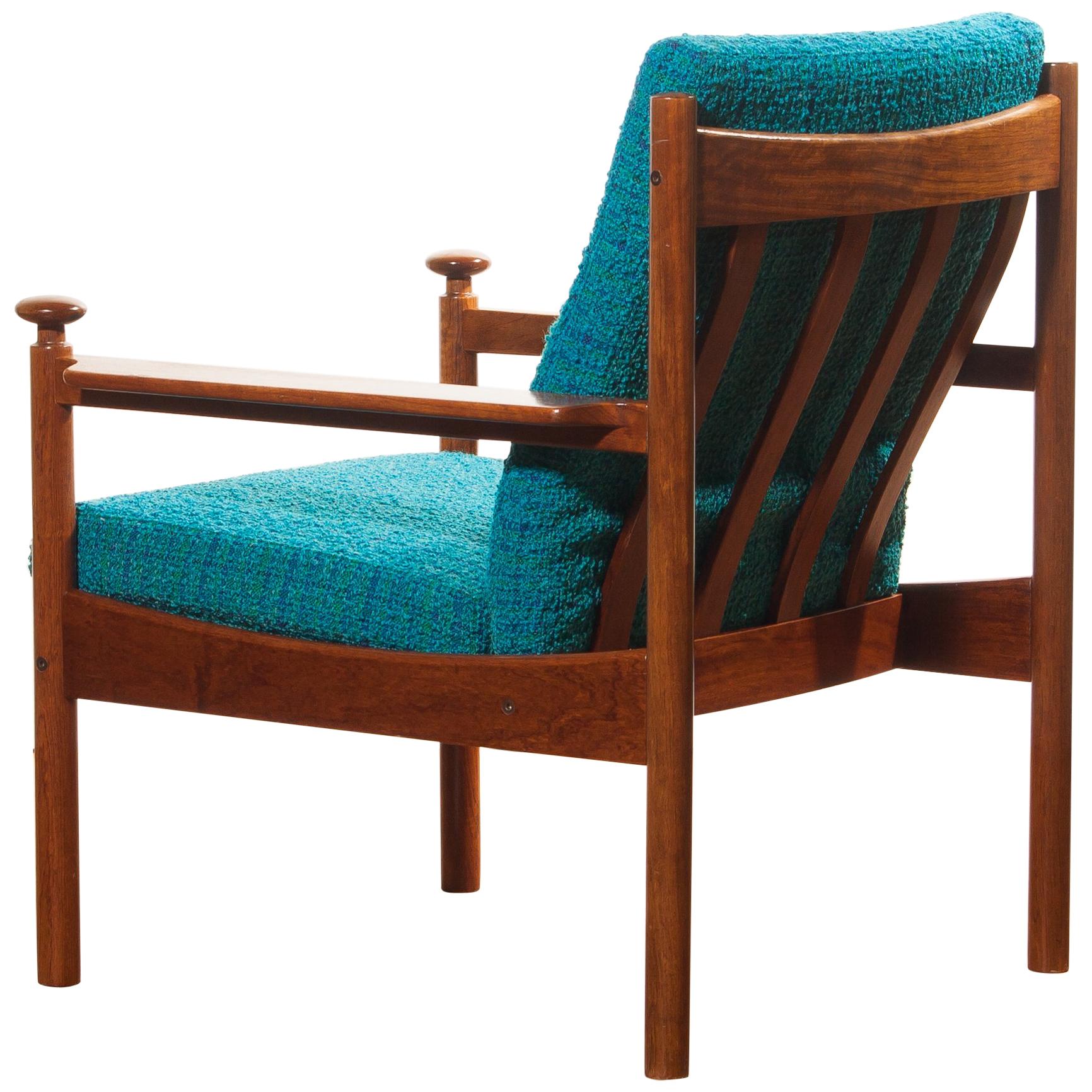 Beautiful chair designed by Torbjørn Afdal for Sandvik & Co. Mobler, Norway.
The wooden frame with the blue fabric cushions makes it a very nice combination.
It is in good condition wear consistent with age and use.
Period 1950s.
Dimensions: H