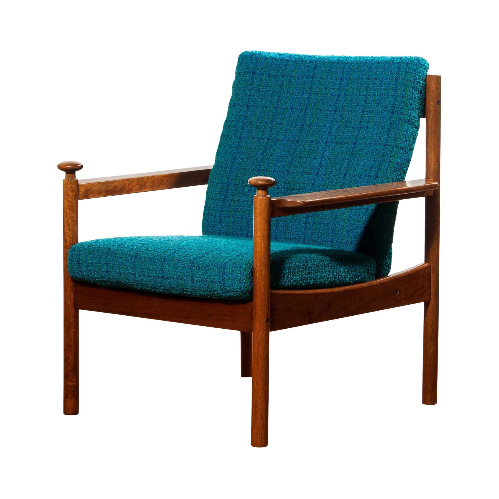 Beautiful chair designed by Torbjørn Afdal for Sandvik & Co. Mobler, Norway.
The wooden frame with the blue fabric cushions makes it a very nice combination.
It is in good condition wear consistent with age and use.
Period: 1950s.
Dimensions: H