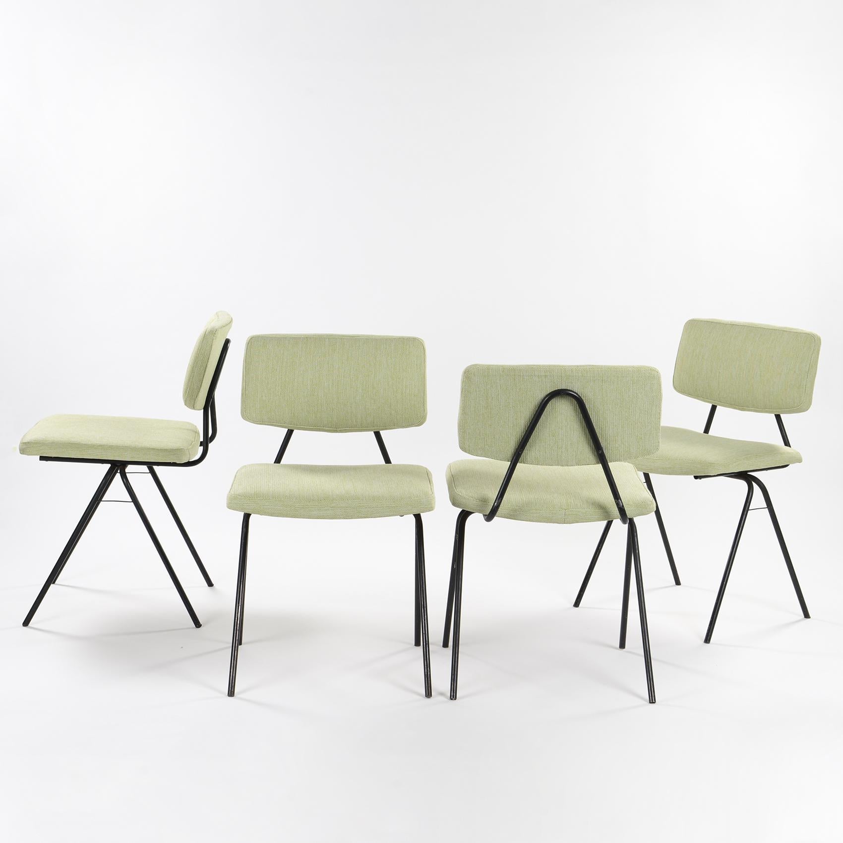 Set of four chairs designed by Pierre Guariche and published by Huchers Minvielle in the 50s.

The chairs are composed of a slightly compass base in black lacquered tubular metal with a restored foam seat and backrest, and covered with a slightly
