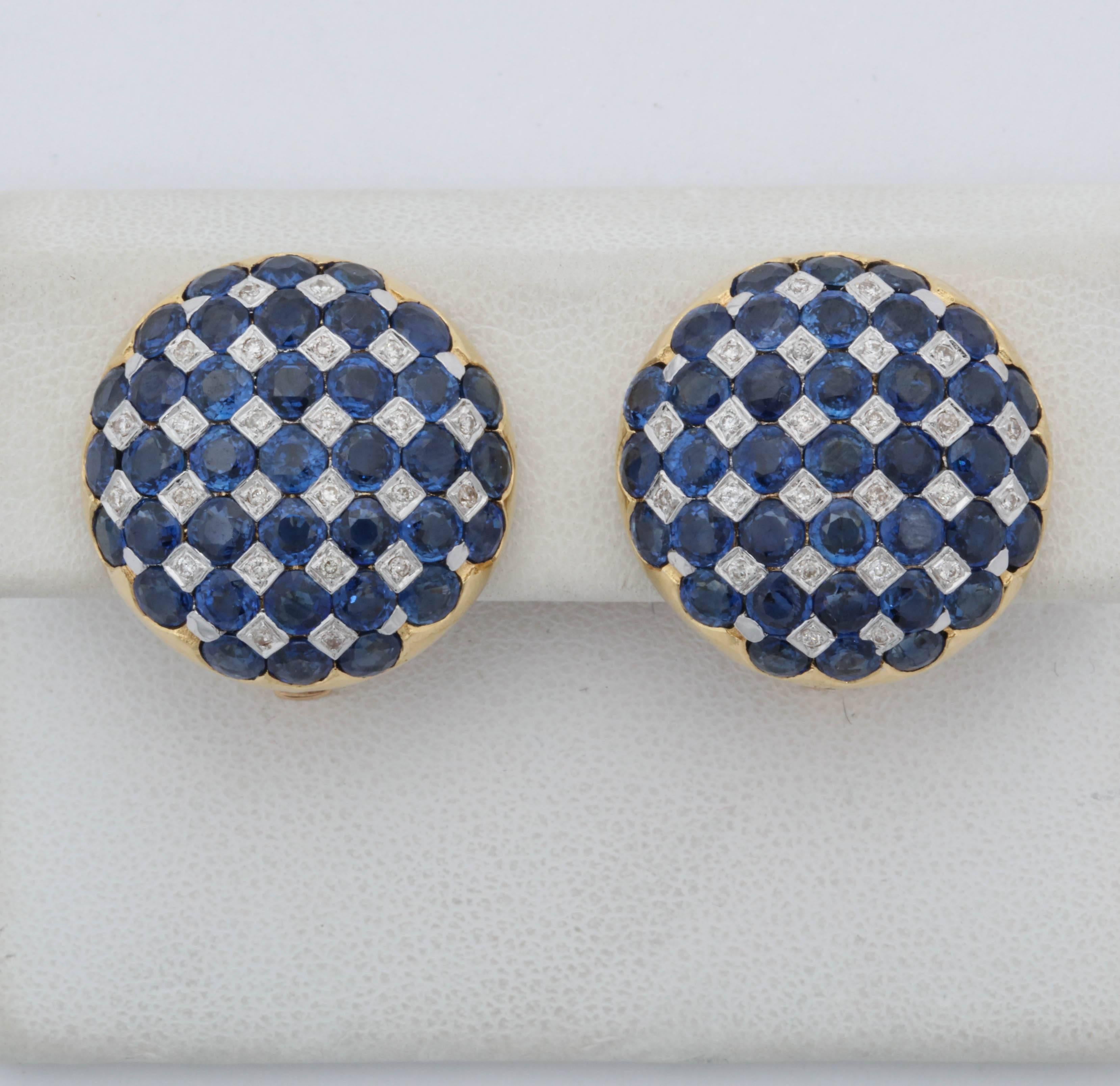 One Pair Of Ladies 18kt Gold And Numbered With a Fine Quality Jewelers serial # Designed In A Round Checkerboard Patter Of Beautiful Color Sapphires Centering Numerous full Cut Diamonds. Total sapphire Weight approximately 5 Carats , Total Diamond