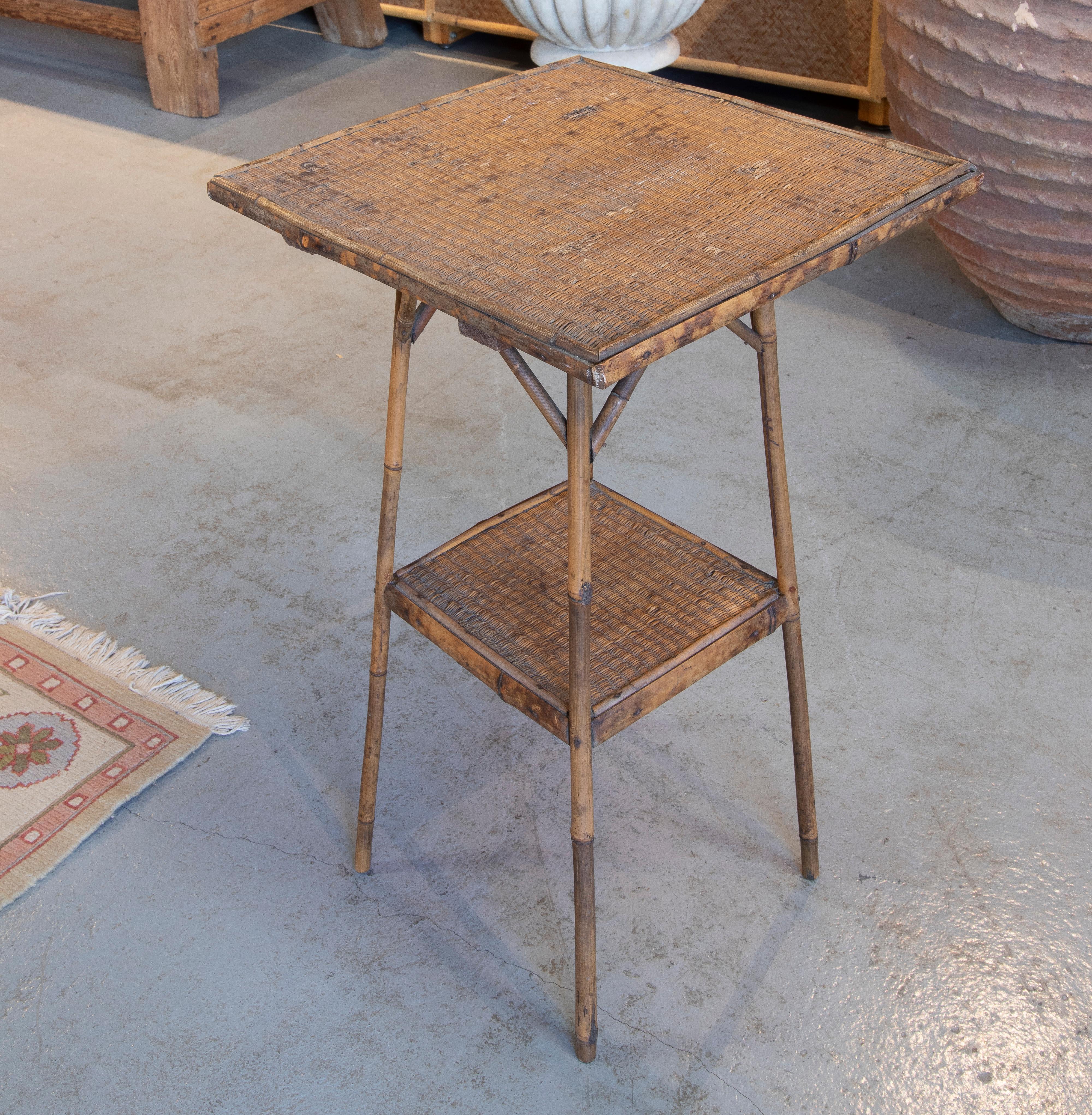 Vintage 1950s Chinese bamboo and woven wicker 1-shelf tall side table.