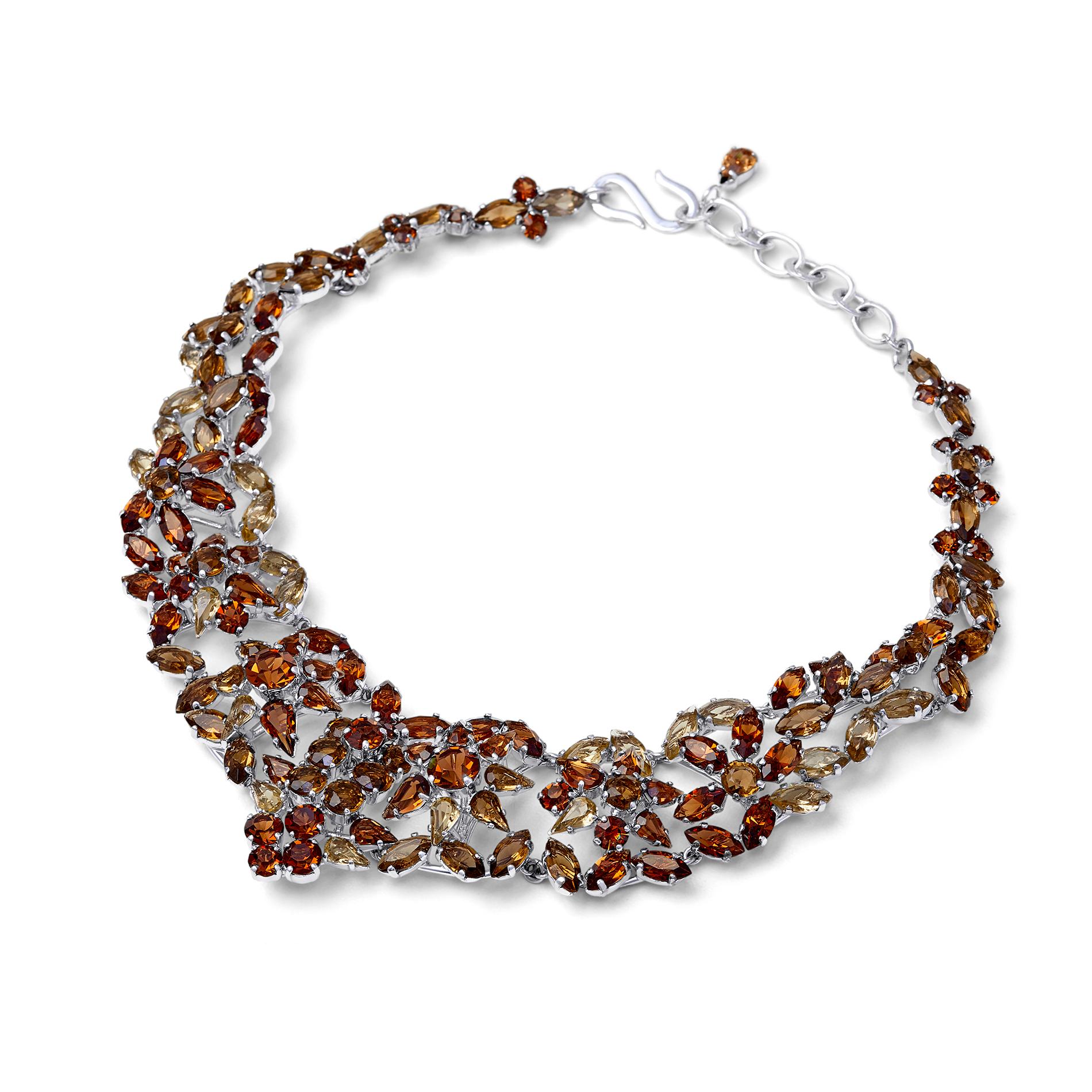Documented 1950s Christian Dior necklace featuring an assortment of glass crystals in smoky quartz and yellow topaz hues. All stones are claw set into a rhodium plated silver base metal. This piece is a classic princess shape and length and designed