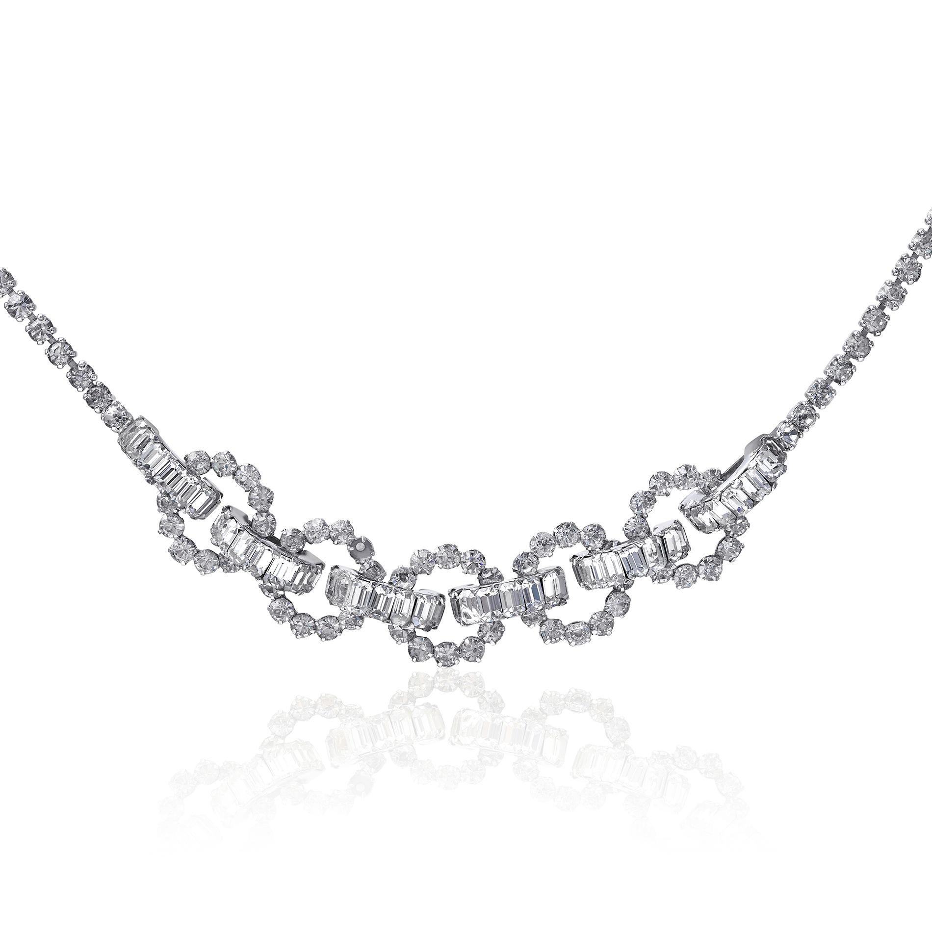 This elegant Christian Dior by Mitchel Maer geometric crystal necklace is rhodium plated, in excellent vintage condition and the gemstones have exceptional clarity. The central circular composition consists of five circles of small facetted prong
