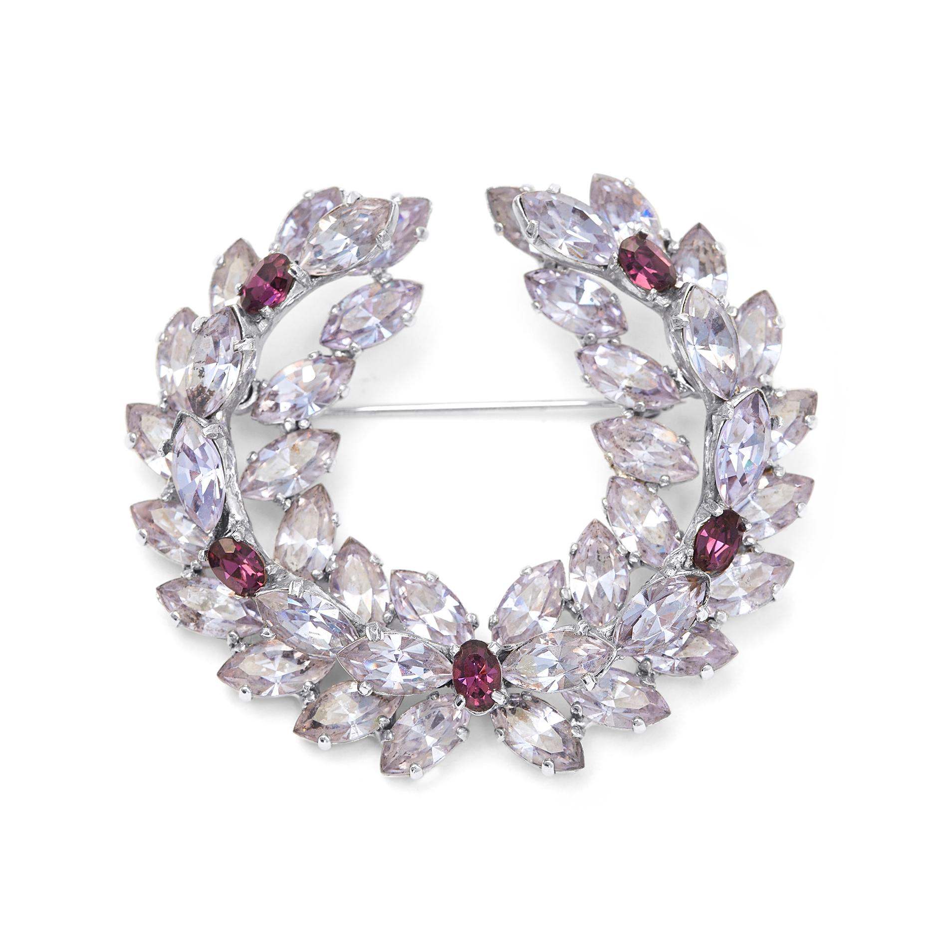 1950s Christian Dior by Mitchel Maer wreath brooch and clip earrings set featuring gradients of amethyst and rhodolite marquis and oval rhinestones and set in rhodium-plating.  The brooch and earrings have a stacked 3 dimensional design.  Both