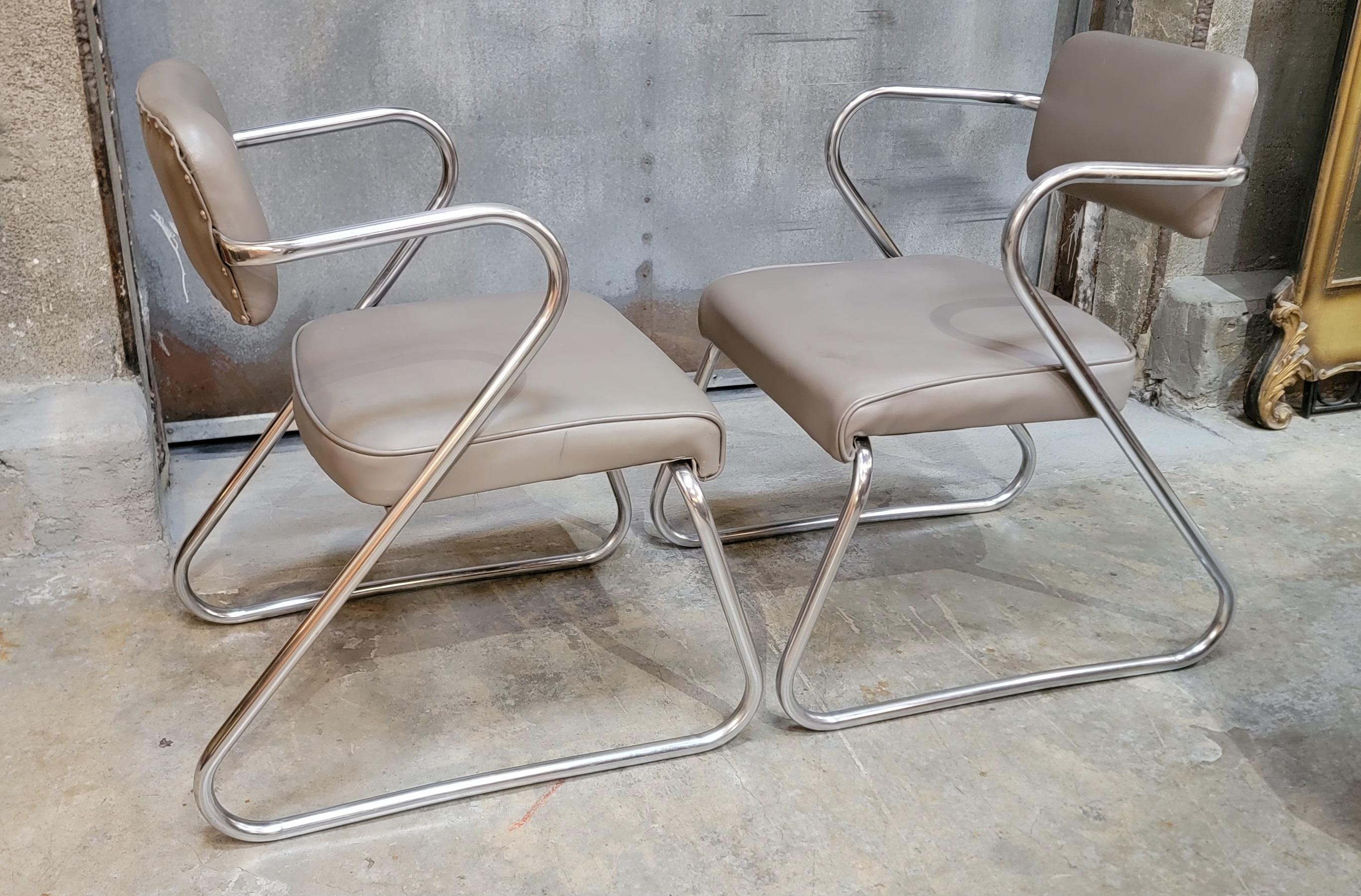 A pair of polished chrome armchairs in the manner of Kem Weber. Circa. 1950's. 