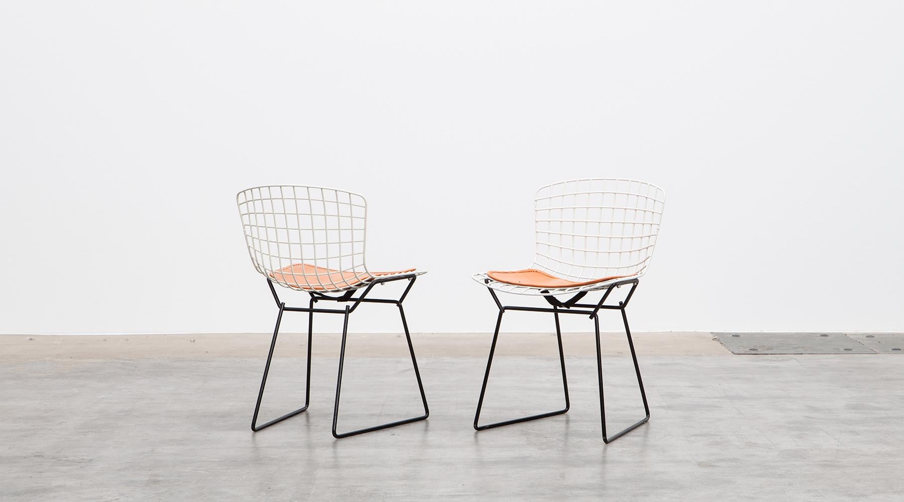 Pair of kids side chair, chrome-plated steel wire by Harry Bertoia, USA, 1952.

Italoamerican Designer Harry Bertoia developed this type of design from the famous 1952 Bertoia chair series, whose chrome-plated steel wires were reshaped by the weight