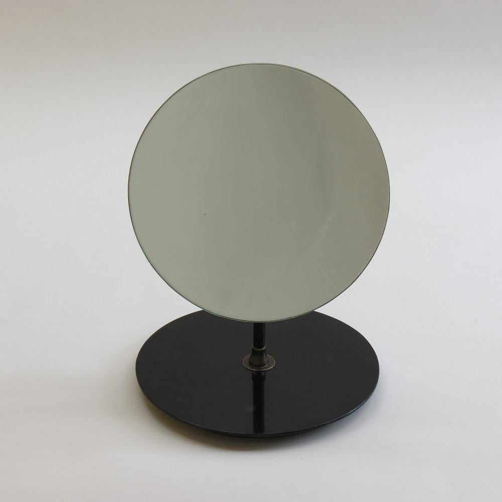Wonderful mirror from the 1950s originally used in a hat shop, with circular mirror on stand. Very good quality, with brass fixings allowing you to adjust the angle of the mirror which have nicely patinated over time.  Glass mirror plate is in good