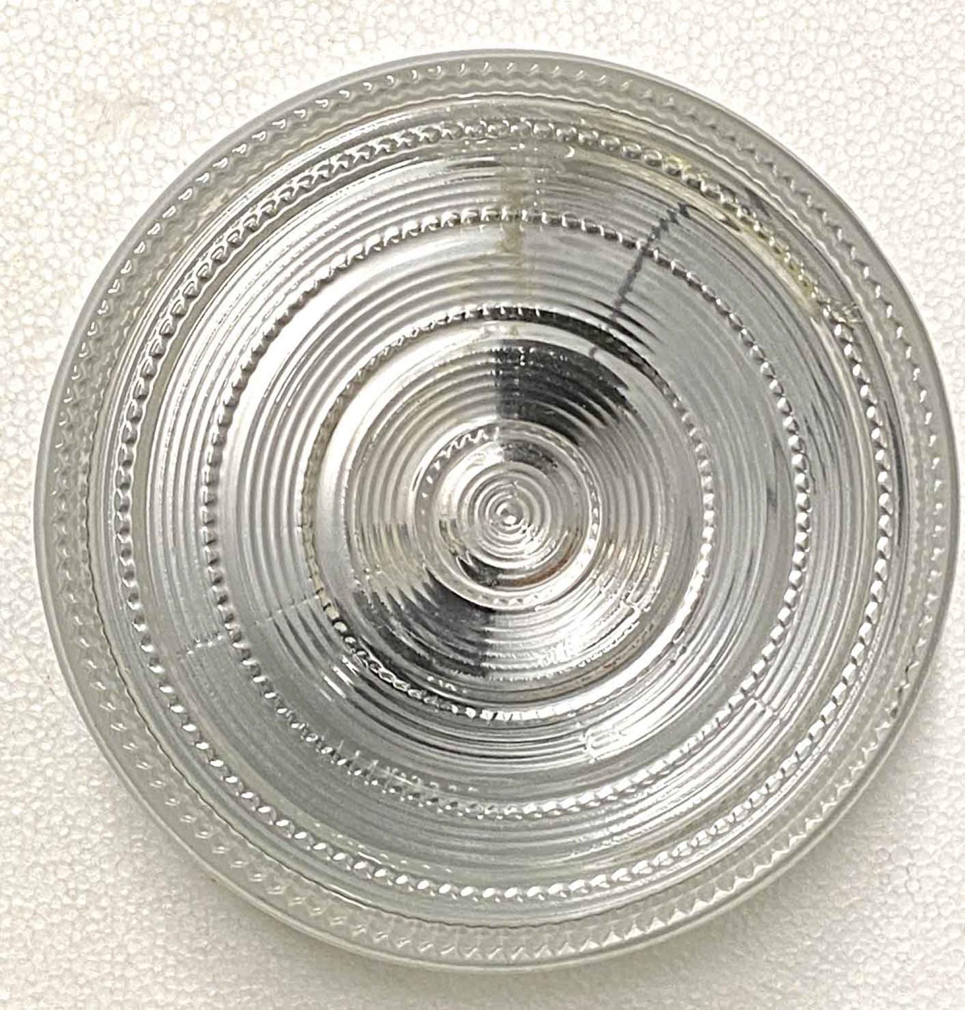 1950s round clear glass flushmount fixture with a chrome plated base. Frosted shade with textured casting. Made in the USA. Small quantity available at time of posting. Priced each.
