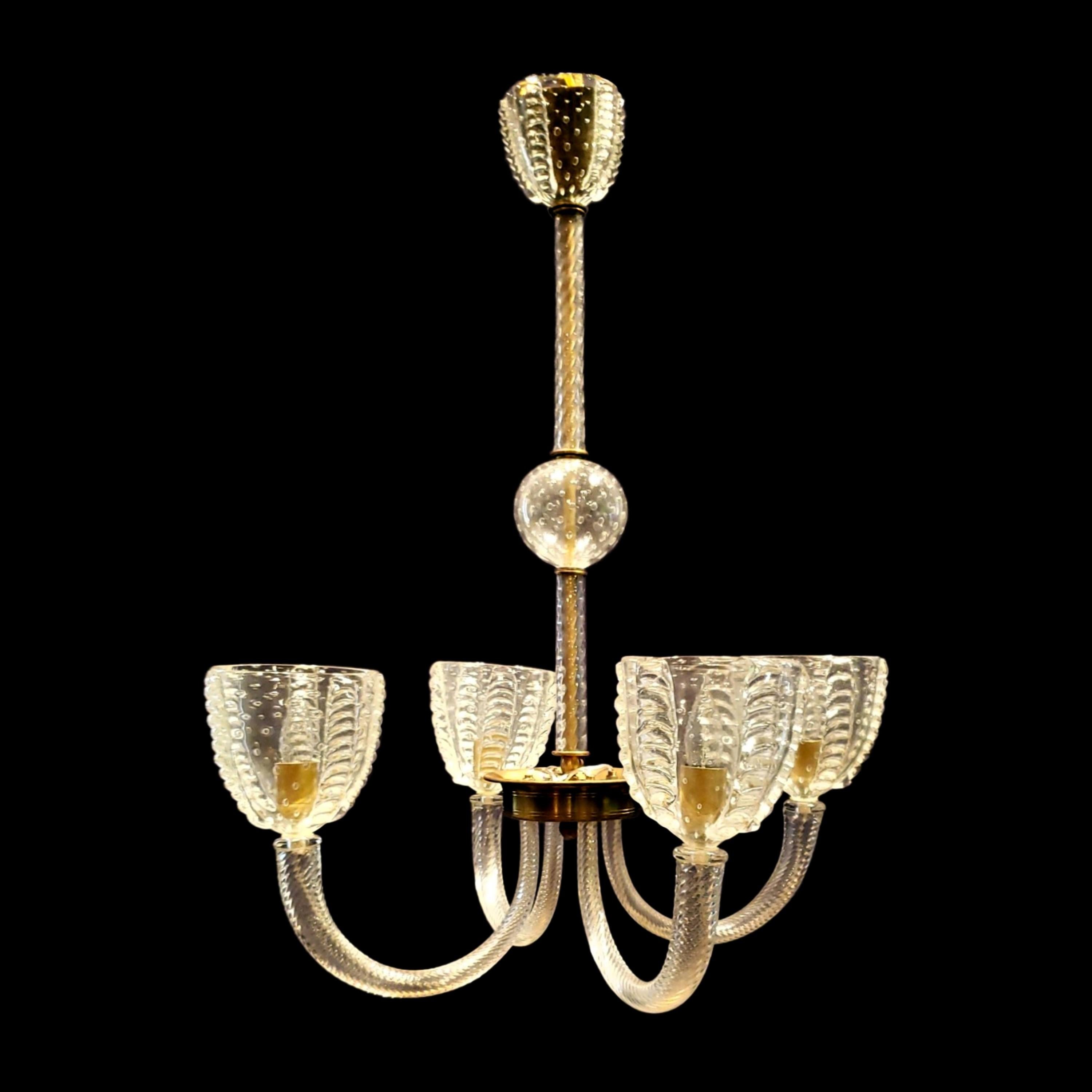 This 1950s Murano hand blown and worked clear glass chandelier features four U shaped arms for a distinctive design. This comes rewired and ready to install. Ships disassembled. Cleaned and restored. Please note, this item is located in one of our