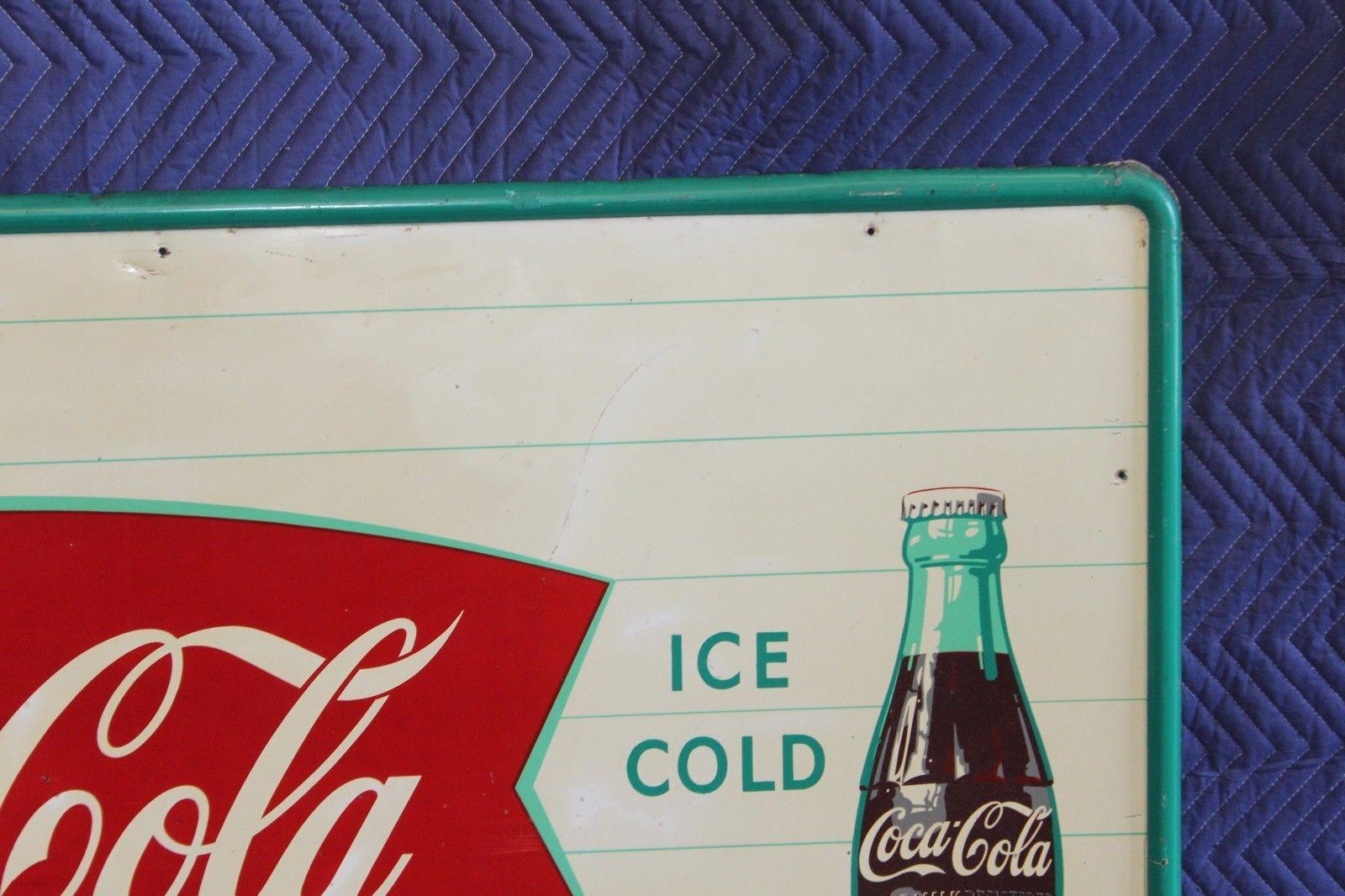 coca cola fishtail sign