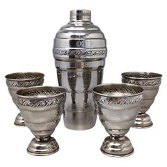 Retro 1950s Cocktail Shaker Set with Four Glasses in Stainless Steel. 