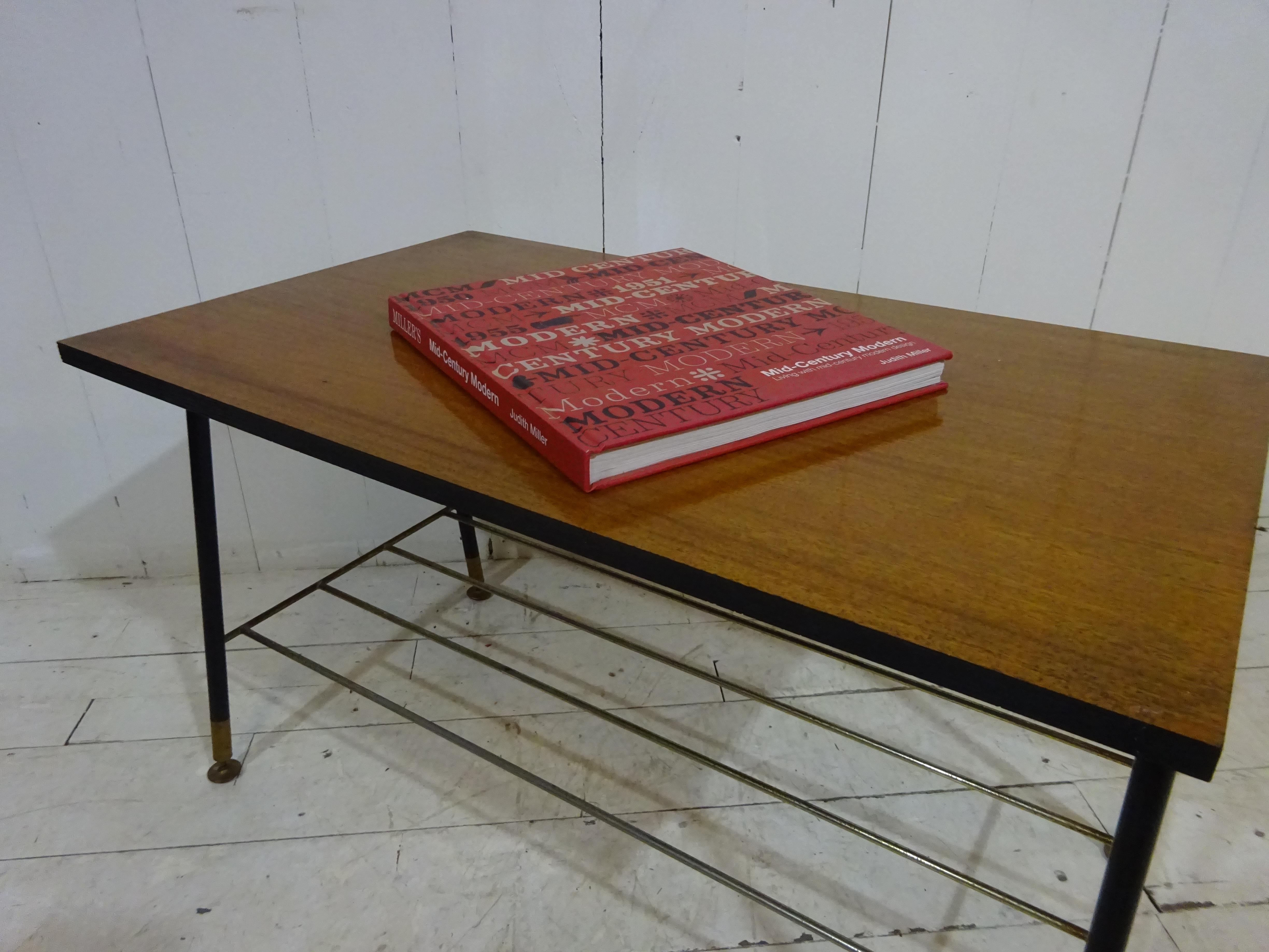 Coffee Table 

A classic and simple design dated mid 1950's. 

Stylish addition to any room. This is a classic 1950's design coffee table. Legs and table support are made from a tubular steel construction finished in a matt black paint. Legs are