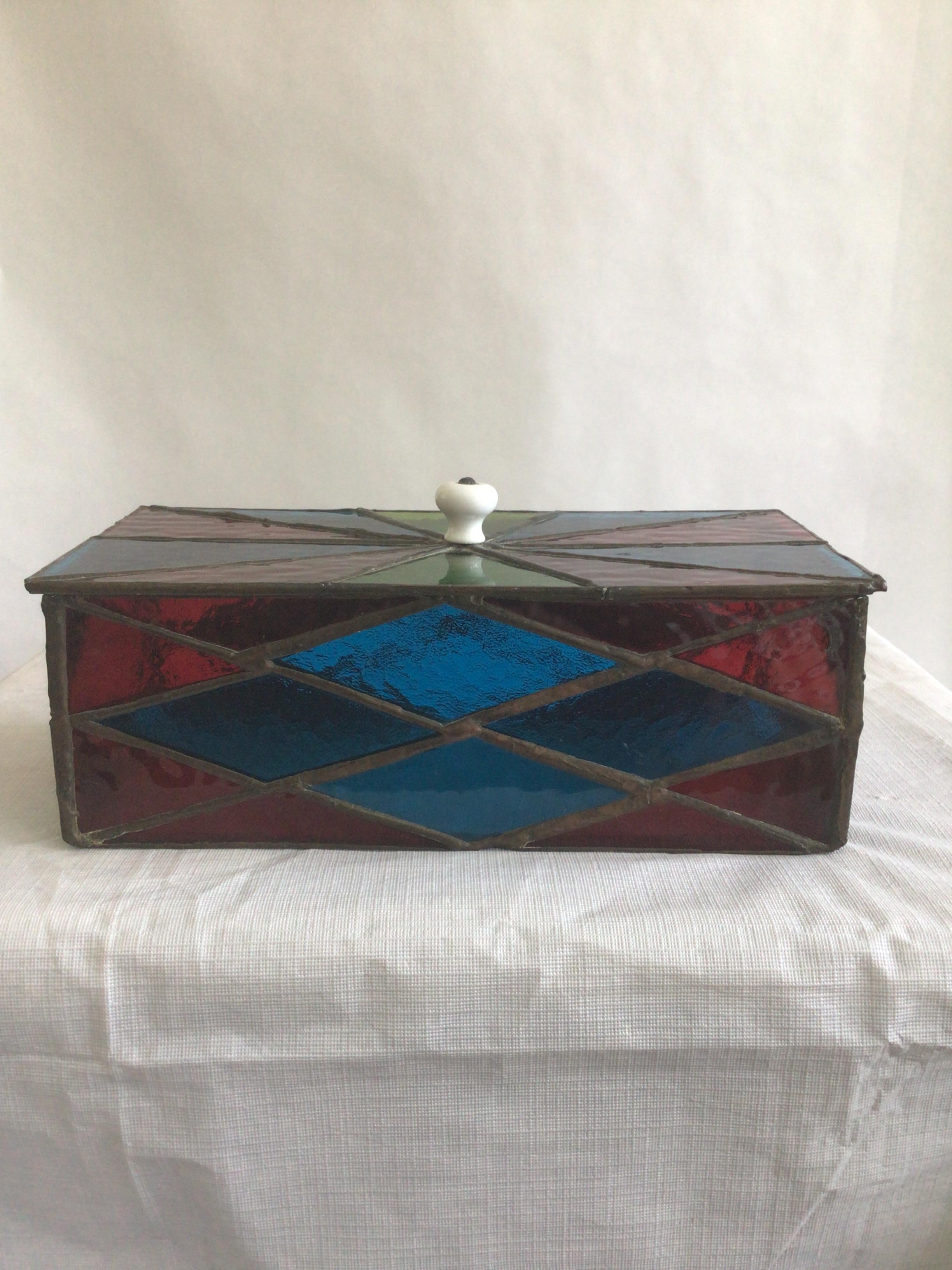 1950s Colorful Leaded Stained Glass Box With Removable Lid
Glass colors: blue, green, red, clear glass bottom
Removable lid has a white knob handle
