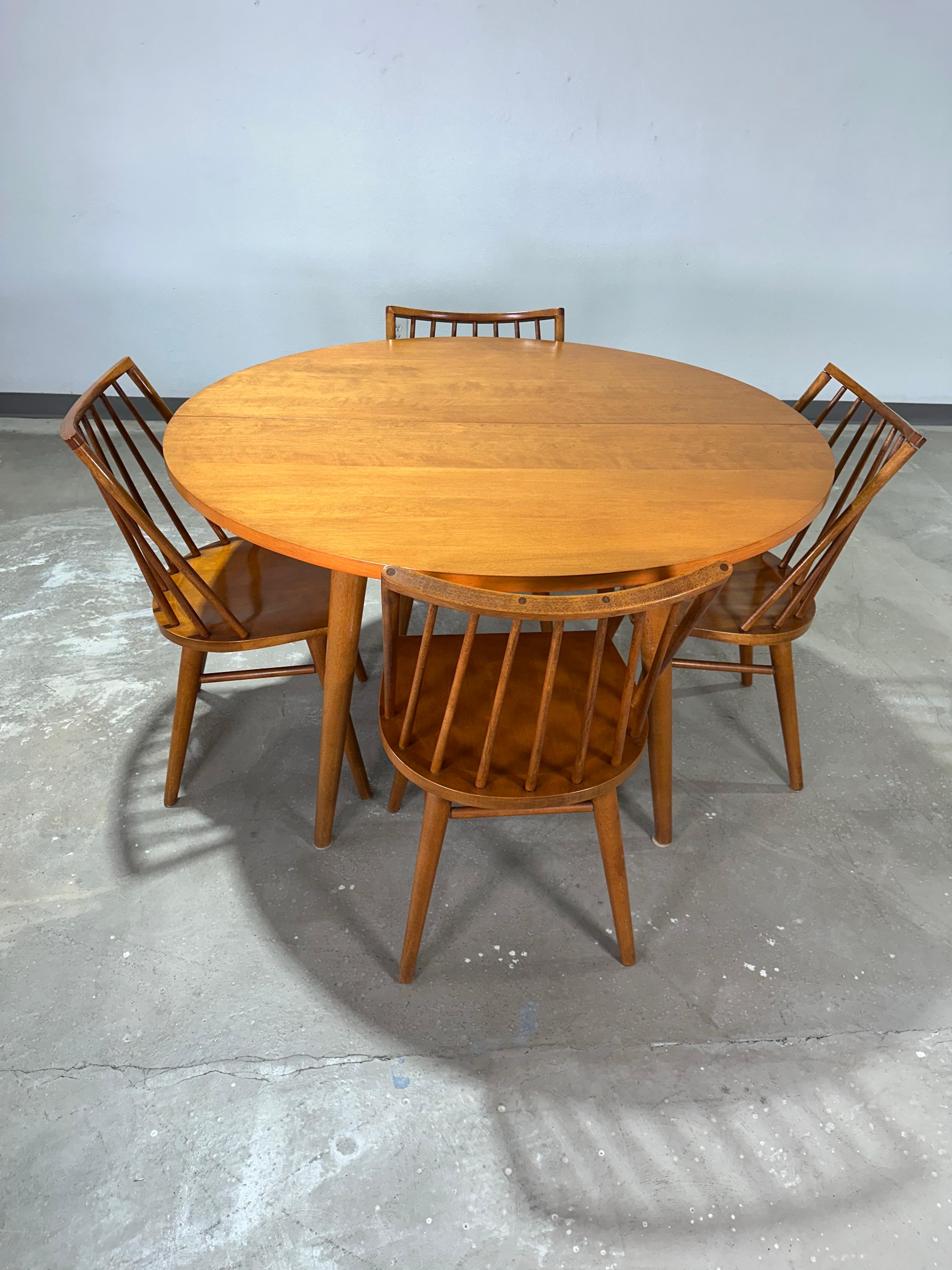 1950’s Blonde Mid Century Modern Solid Birch Conant Ball “Modernmates” Dining Room Table with two leaves, table pads, and four dining chairs. Clean simple and stylish design impeccably maintained and in great original condition. Modernist angular