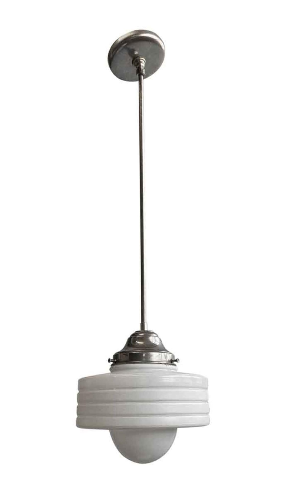 1950s white cast glass light globe with concentric circles with brushed steel finished fitter. Can be viewed as Art Deco or Streamline Moderne style. This can be seen at our 400 Gilligan St location in Scranton. PA.