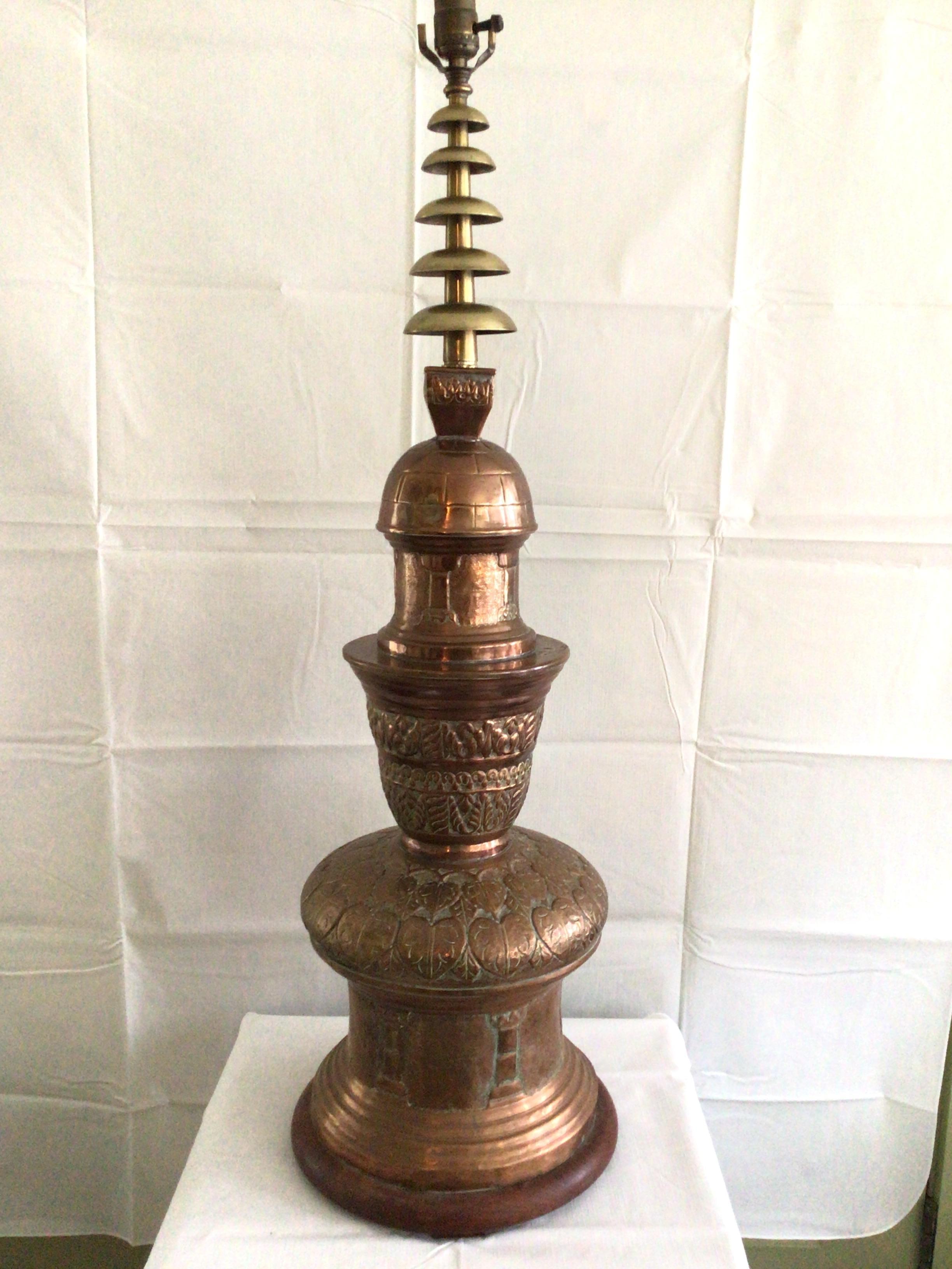 1950s copper and brass ornate table lamp on wood base.