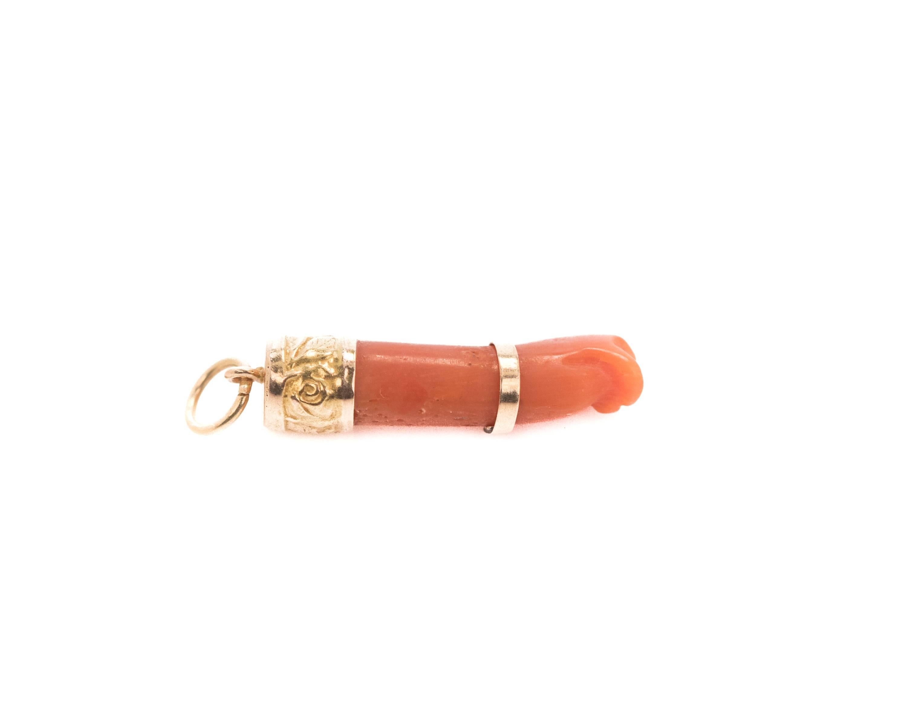 1950s Retro Figa Charm - 18K Yellow Gold, Coral

Features a beautiful orange-red coral arm and hand. A band of rich, high polish 18 Karat Yellow Gold forms a bracelet on the wrist. The end is capped in 18 Karat Yellow Gold. The cap is embellished