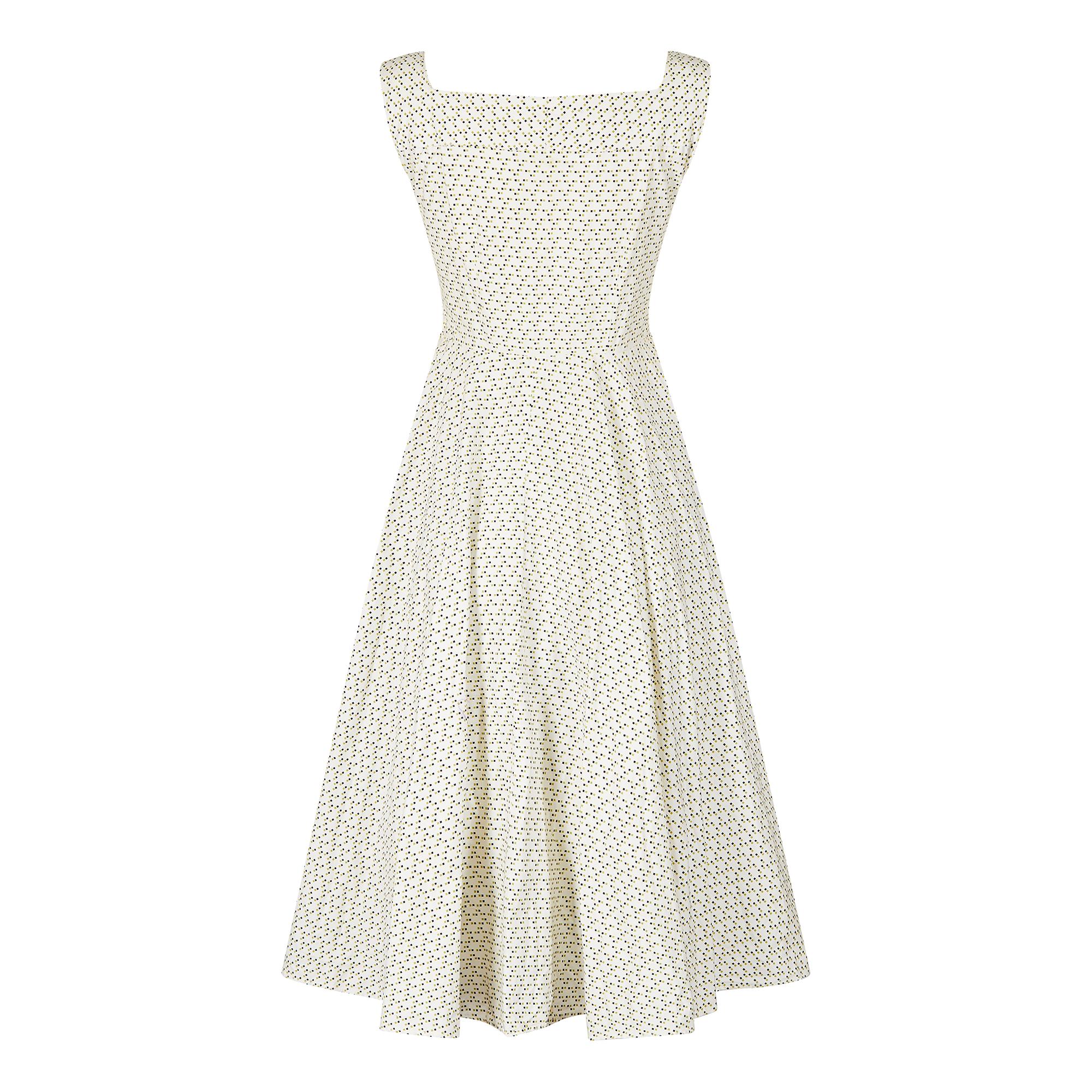 We really love the simplicity of the design of this classic 1950s dress. The skirt is almost a full circle with a stiffed calico petticoat and the pattern reminds us of the space invaders game as the dots look like mini spaceships! The pattern is