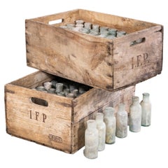 1950's Crate Of Faded French Glass Bottles