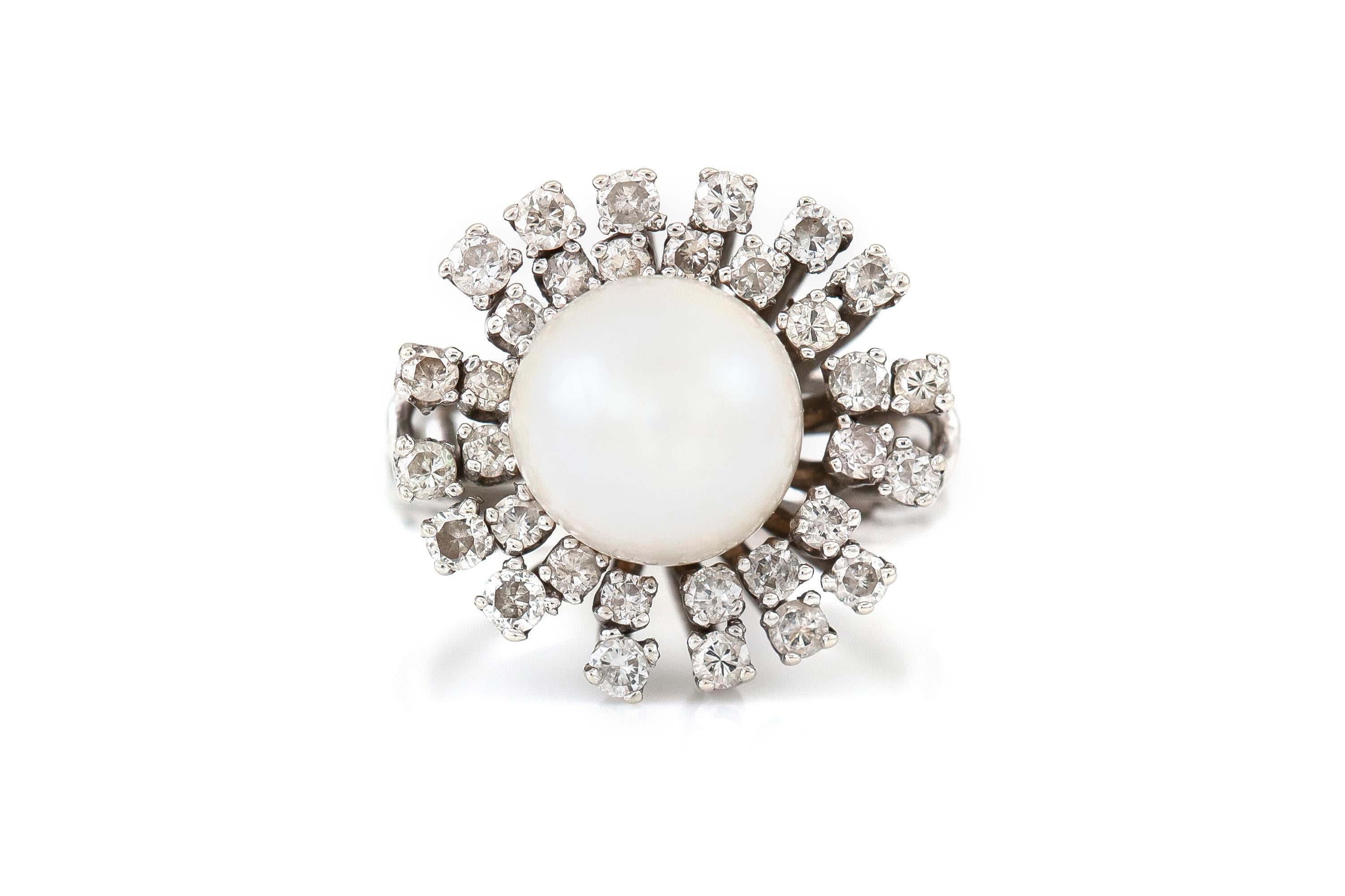 The ring is finely crafted in 14k white gold with center pearl and diamonds weighing approximately total of 1.00 carat.
Circa 1950.