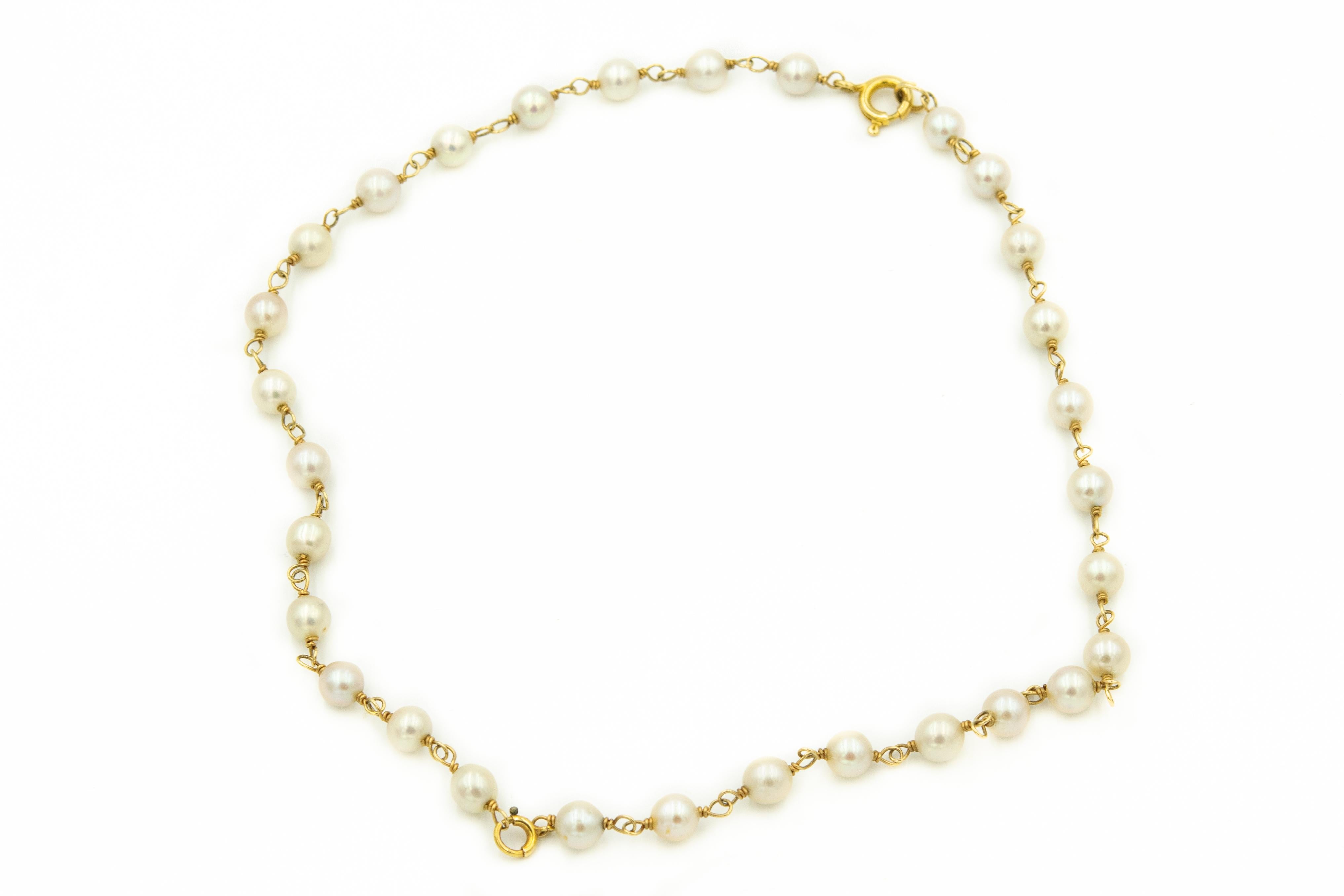 Classic 1950s cultured pearl and 14k yellow gold necklace which can be converted to two bracelets so you have the choice to wear either way.  The prior owner added an extra jump ring clasp so she could do this.  The necklace is 15