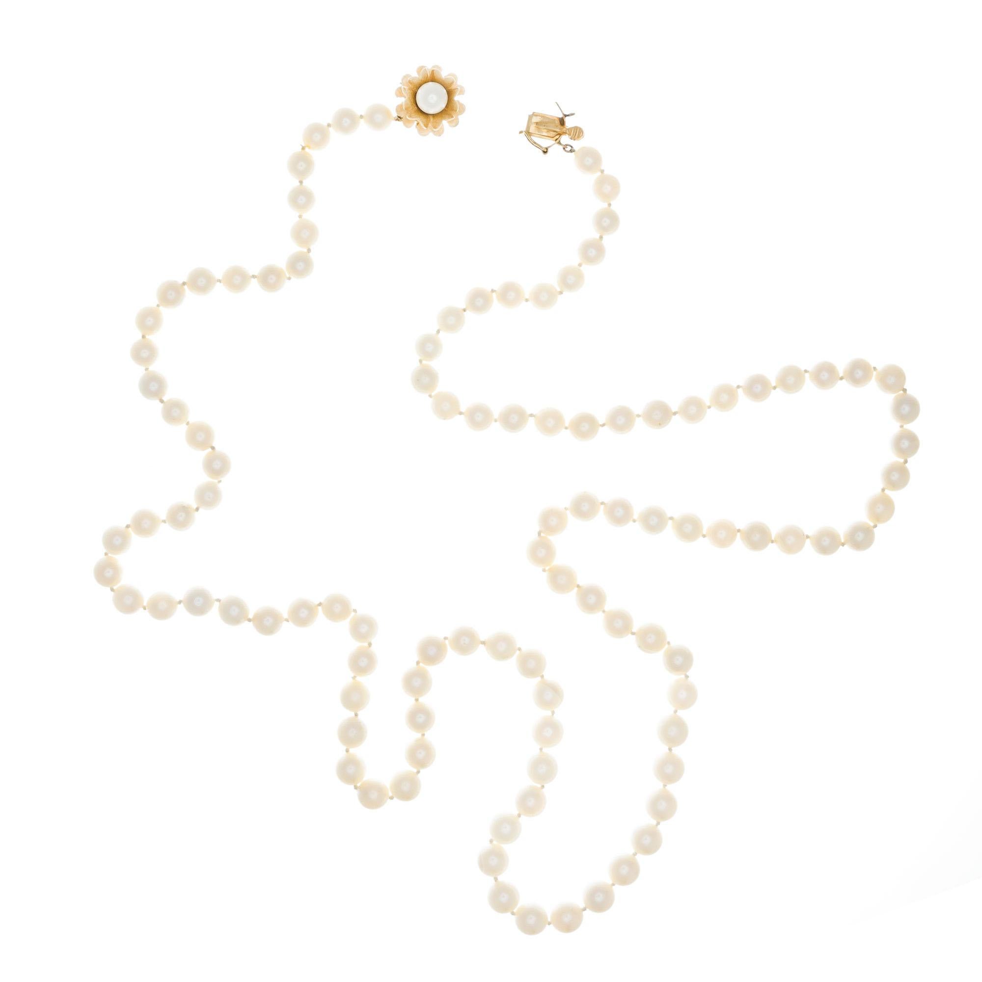 Mid-Century 1950’s 30 Inch cultured pearl necklace with 14k yellow gold flower catch with a pearl. White with slight crème overtone, good lustre. Few to moderate blemishes. Well matched.

105 cultured white pearls, 6.5mm
14k yellow gold 
Stamped: