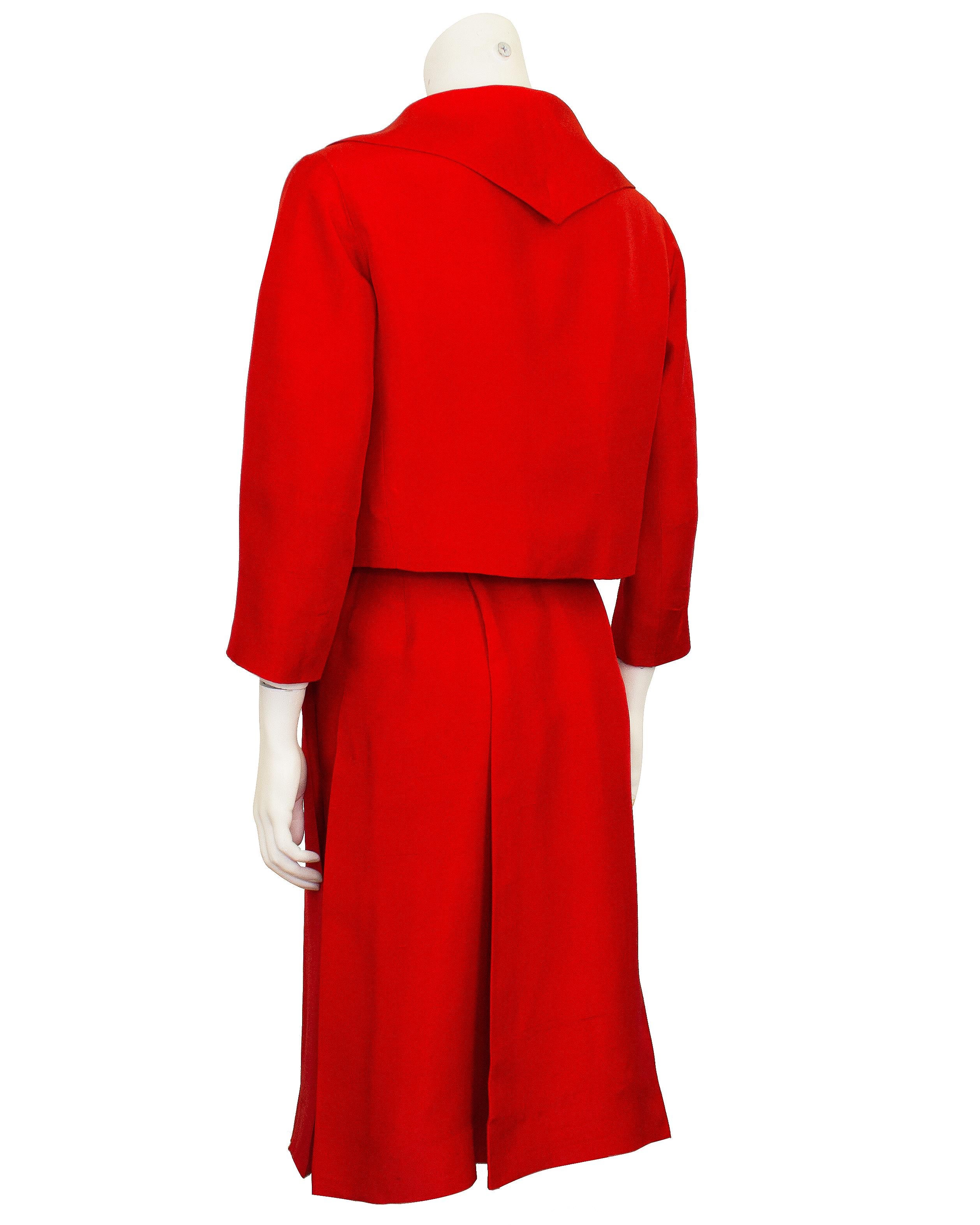 Absolutely stunning, bright and very lady like Curiel ensemble from the 1950's. The ensemble features a red silk jacket and a dress that looks like a floral top and matching red skirt. The jacket is cropped with a shawl handkerchief collar, bracelet
