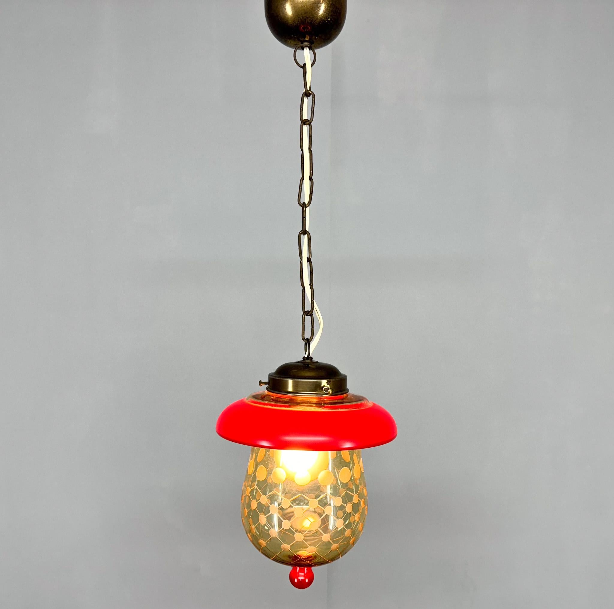 Mid-century small pendant light made of cut glass and brass. Produced in Germany in the 1950's. 
Bulb: 1 x E27 (E26). US wiring compatible.