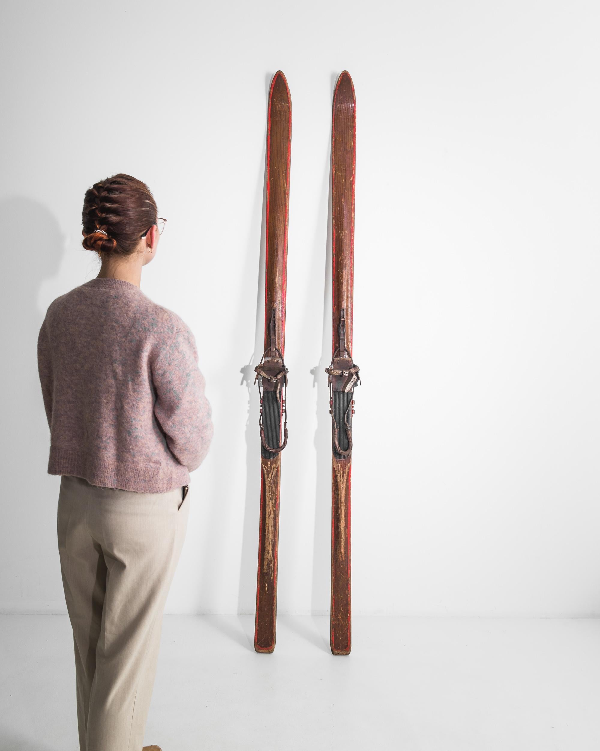 This pair of vintage skis evokes the majesty of winter in the Carpathian mountains. Made in Czechia in the 1950s, the long, slender design indicates that these skis would have been used for cross country skiing, an ancient mode of transport which