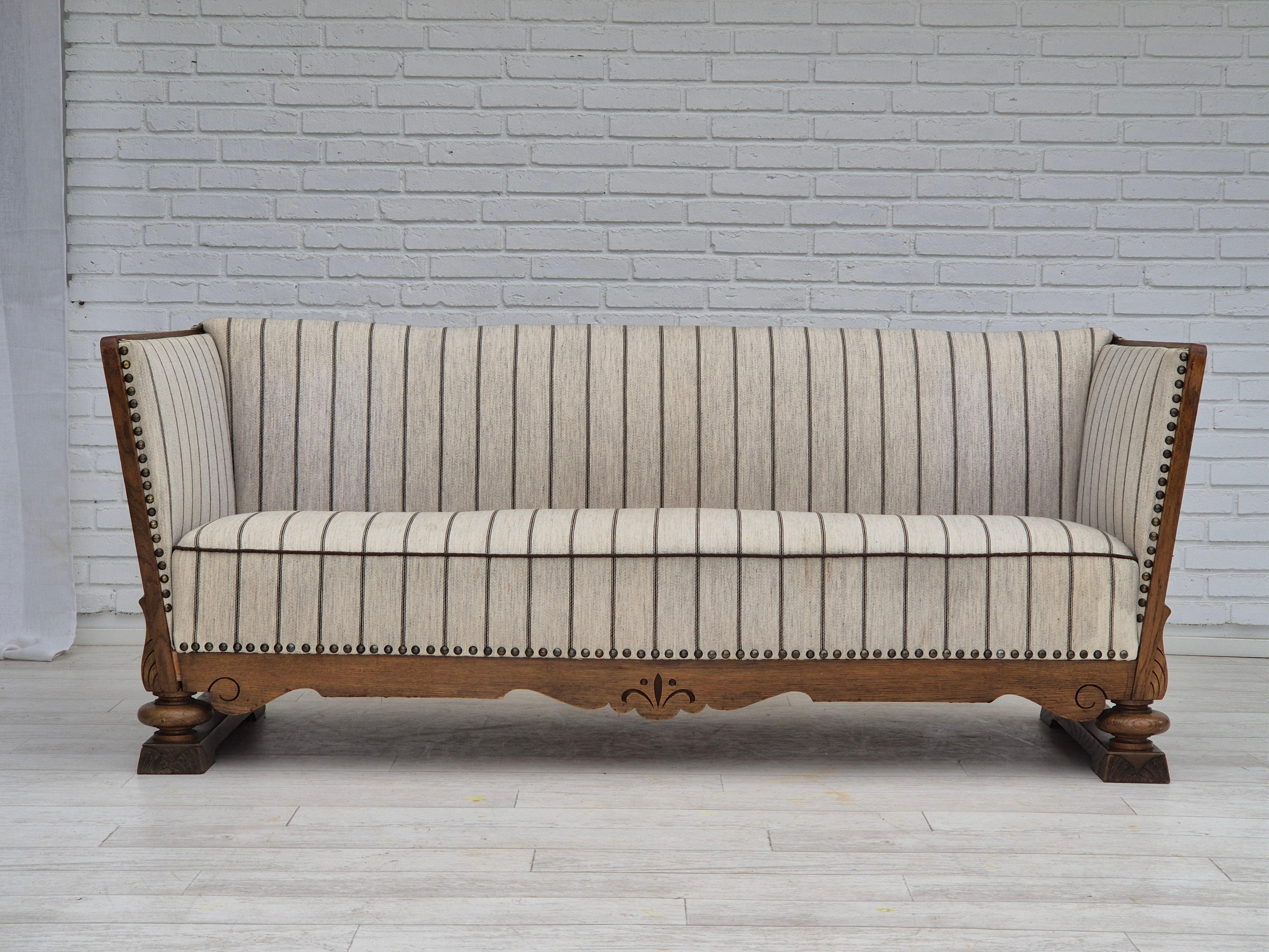 Scandinavian Modern 1950s, Danish 2 seater sofa in quality furniture wool, oak wood. For Sale