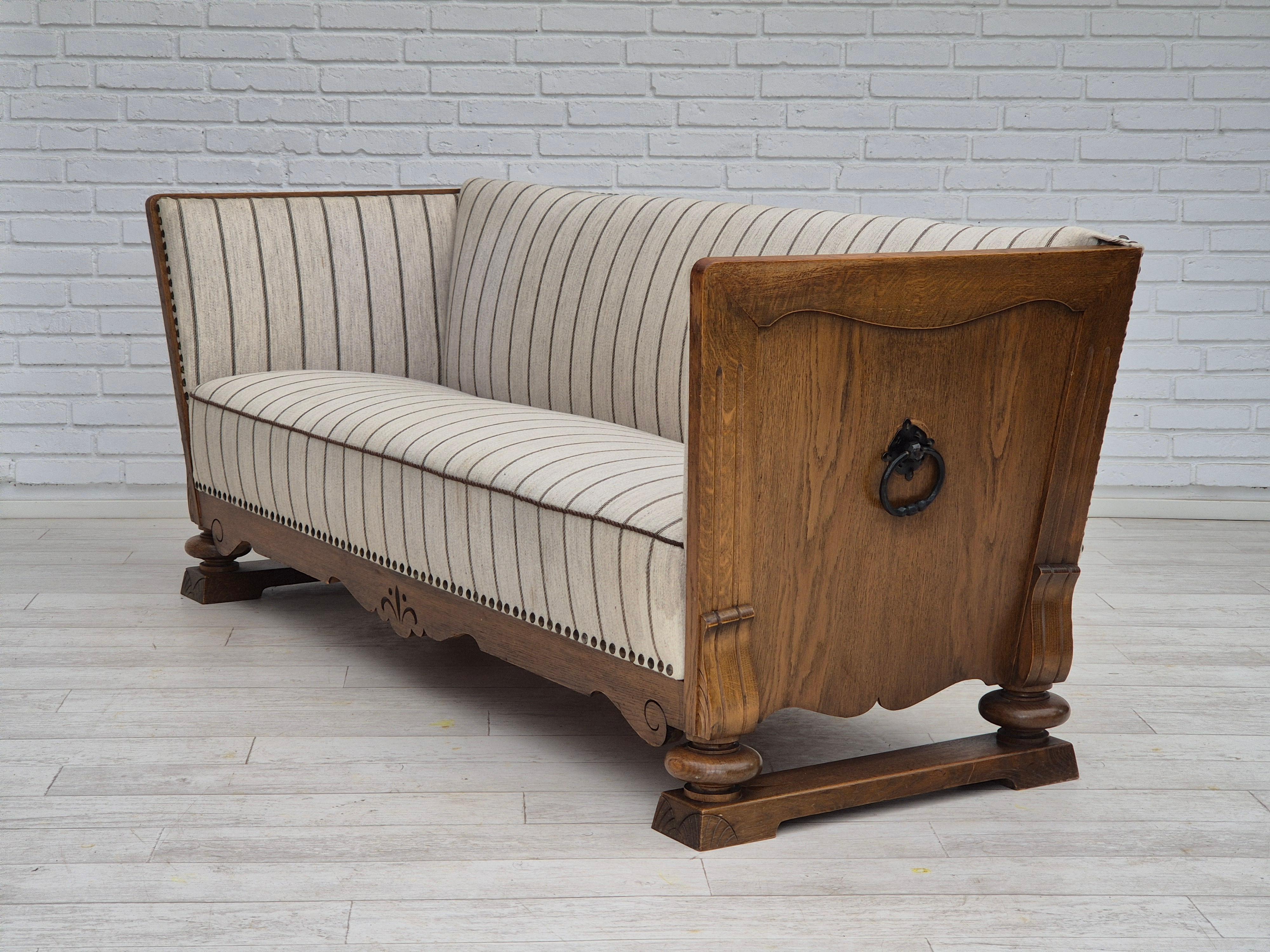 1950s, Danish 2 seater sofa in quality furniture wool, oak wood. For Sale 1