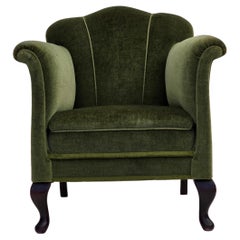 Poltrona danese degli anni '1950, velluto verde da arredamento, gambe in legno di frassino.