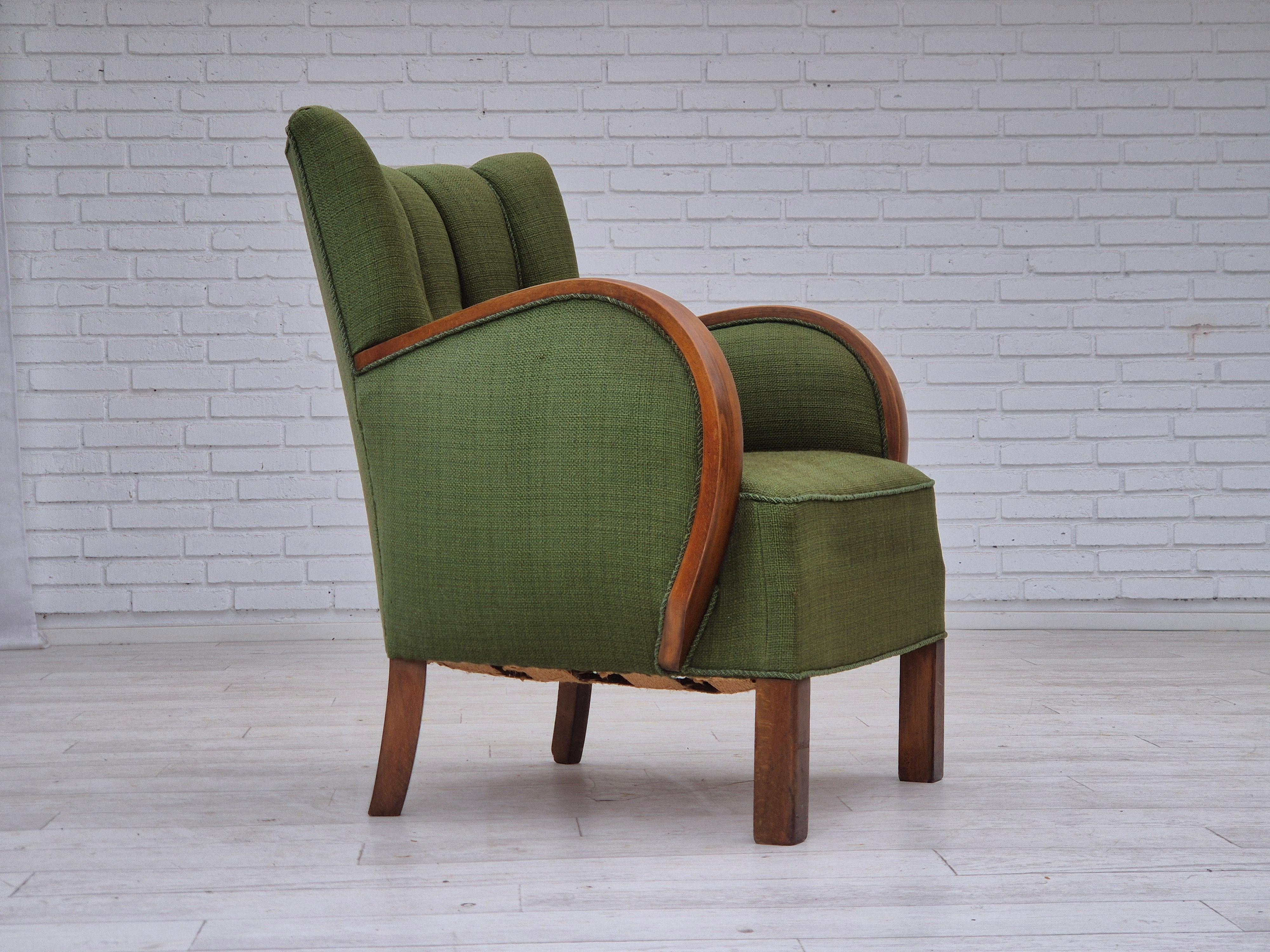 1950s, Danish artdeco armchair. Green furniture wool, beech wood legs, springs in the seat. Original good condition: no smells, no stains and stable construction, slightly faded fabric on the back of the backrest. Manufactured by Danish furniture