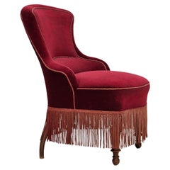 1950s, Danish cocktail lounge chair, cherry-red furniture velour.