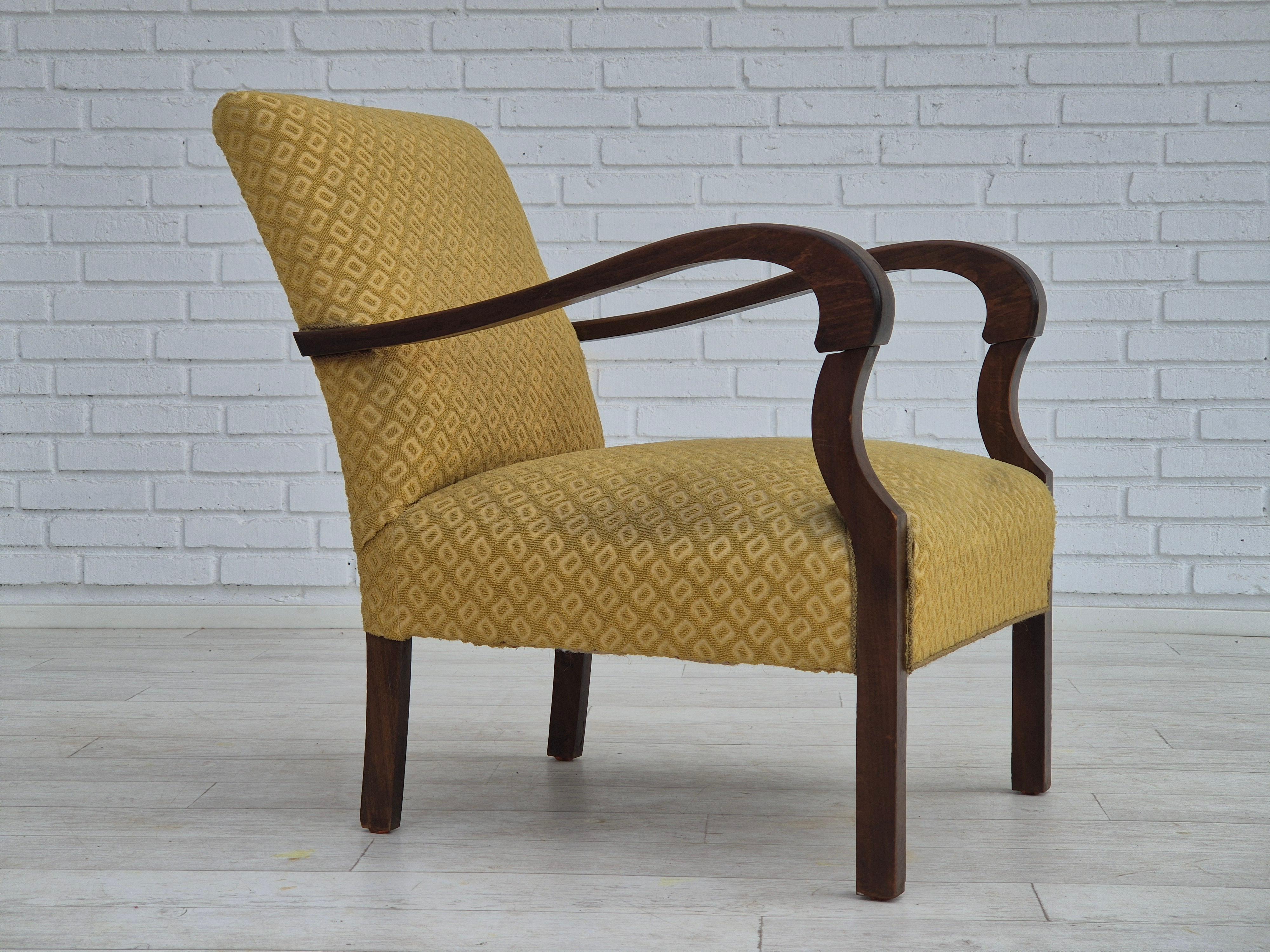 1950s, Danish design. Armchair in original, very good condition: no smells and no stains. Yellow furniture cotton/ wool fabric. Beech wood legs and armrests, brass springs in the seat. Manufactured by Danish furniture manufacturer in about 1950-55s.