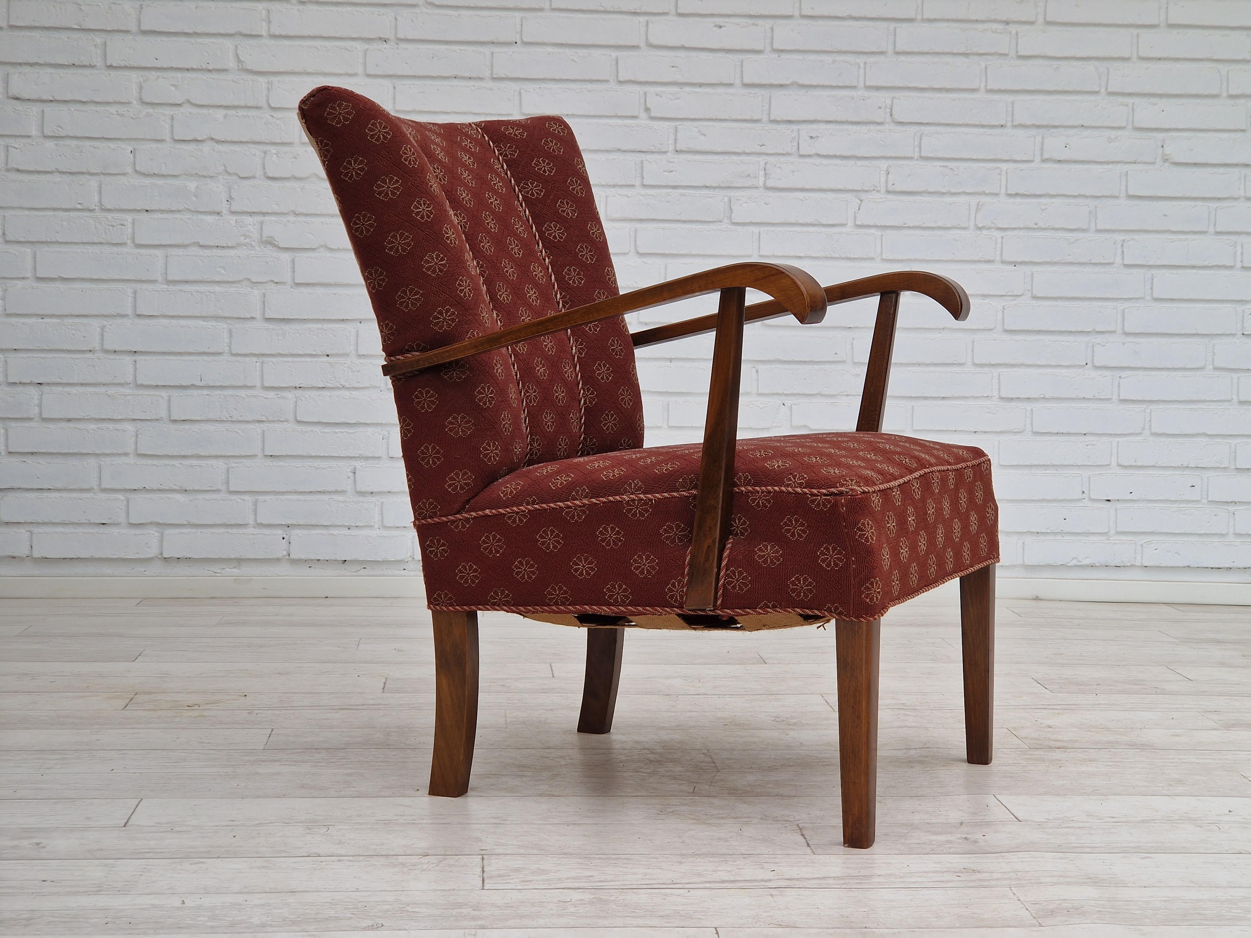 1950s, Danish design. Original armchair in very good condition. No smells and no stains. Original brown cotton fabric in two colors. Legs and armrest in dark lacquered beechwood. Brass springs in the seat.